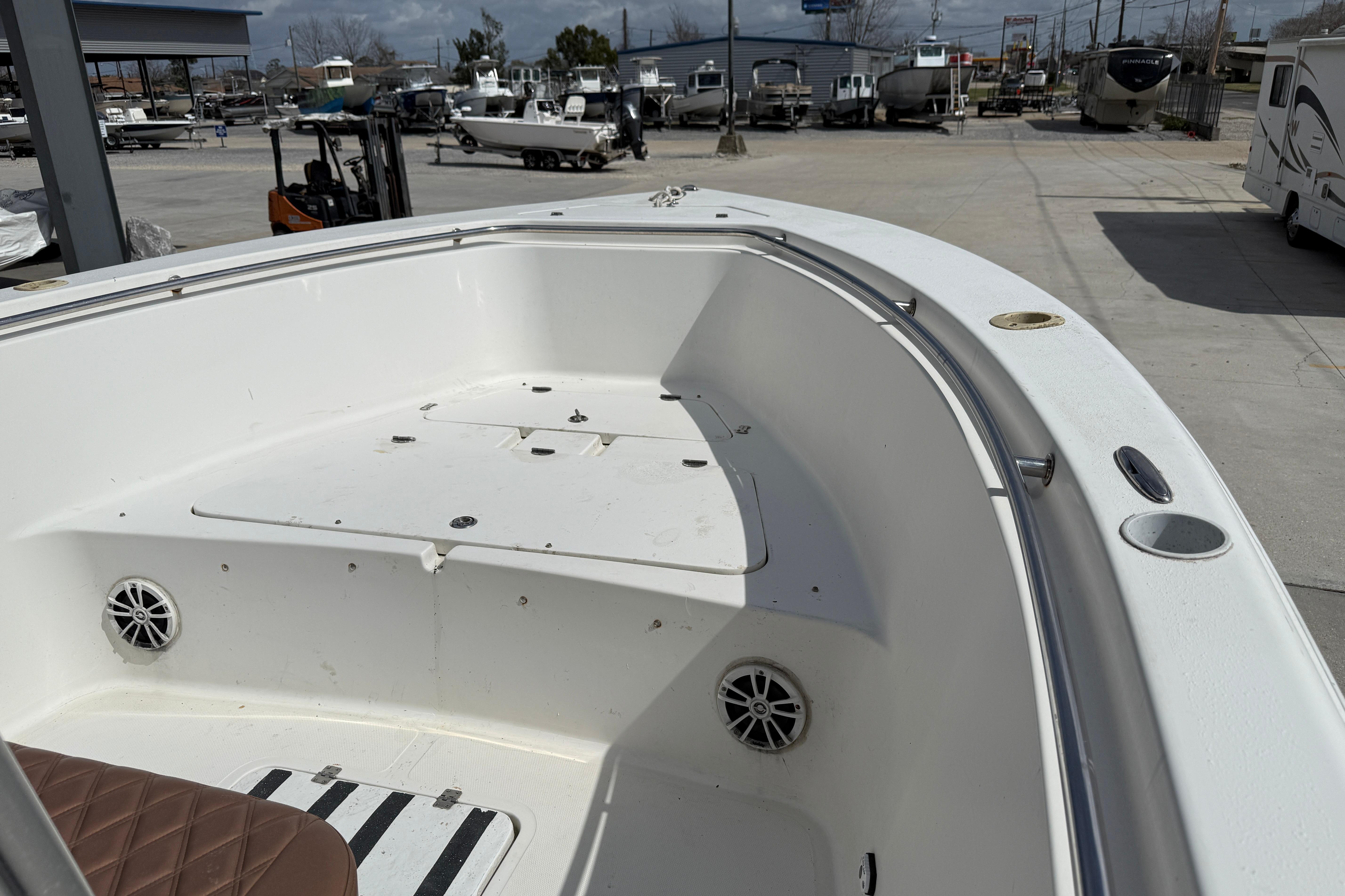 2007 Sea Pro 270 Center Console boat interior with seating and speakers.