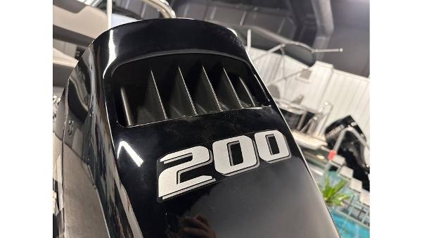 Close-up of a 200 horsepower engine on a 2025 Tahoe Pontoon Cascade Cruise Rear Bench.