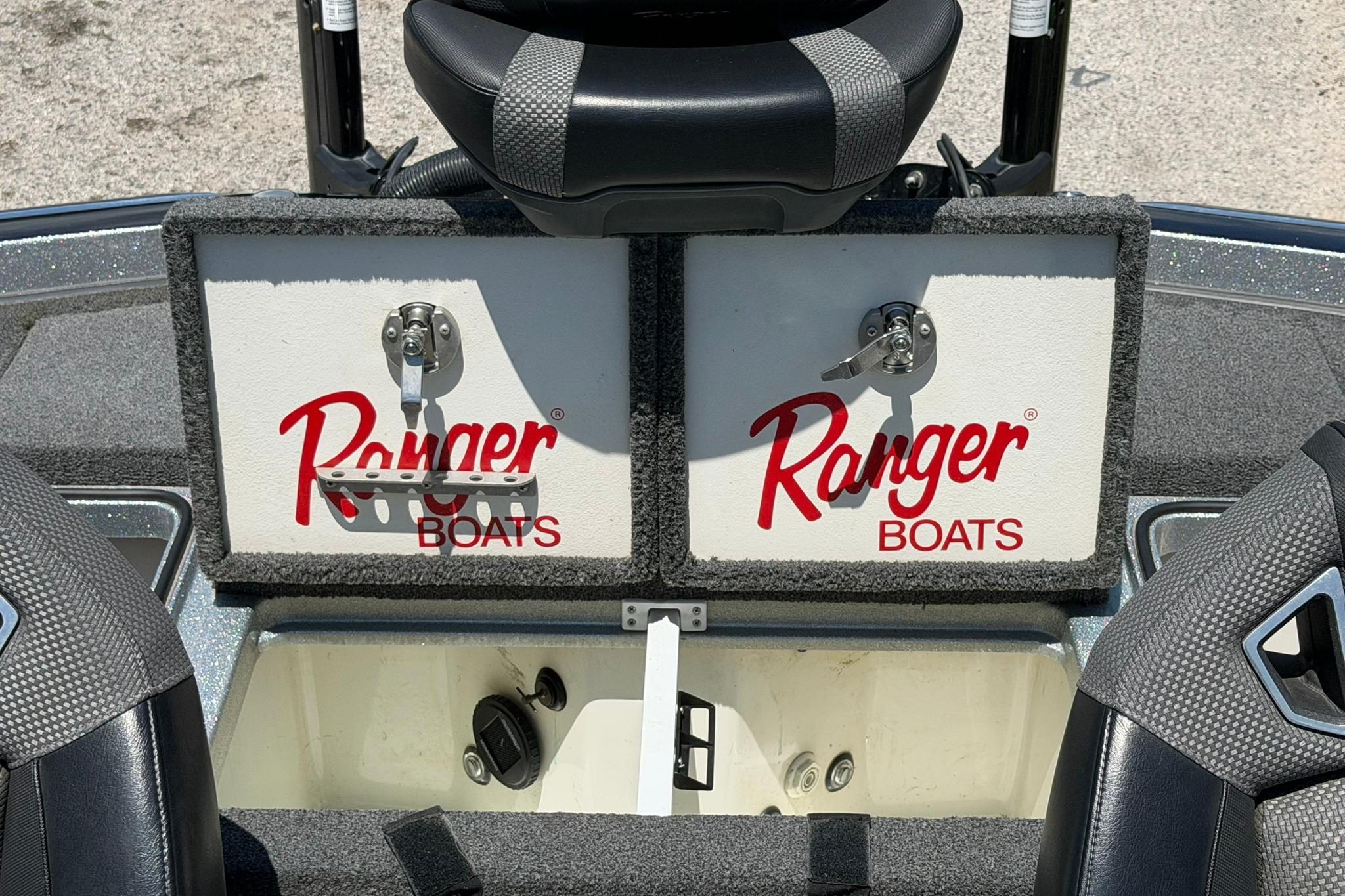 2023 Ranger Z521R boat storage compartments with logo, featuring secure latches and seating.