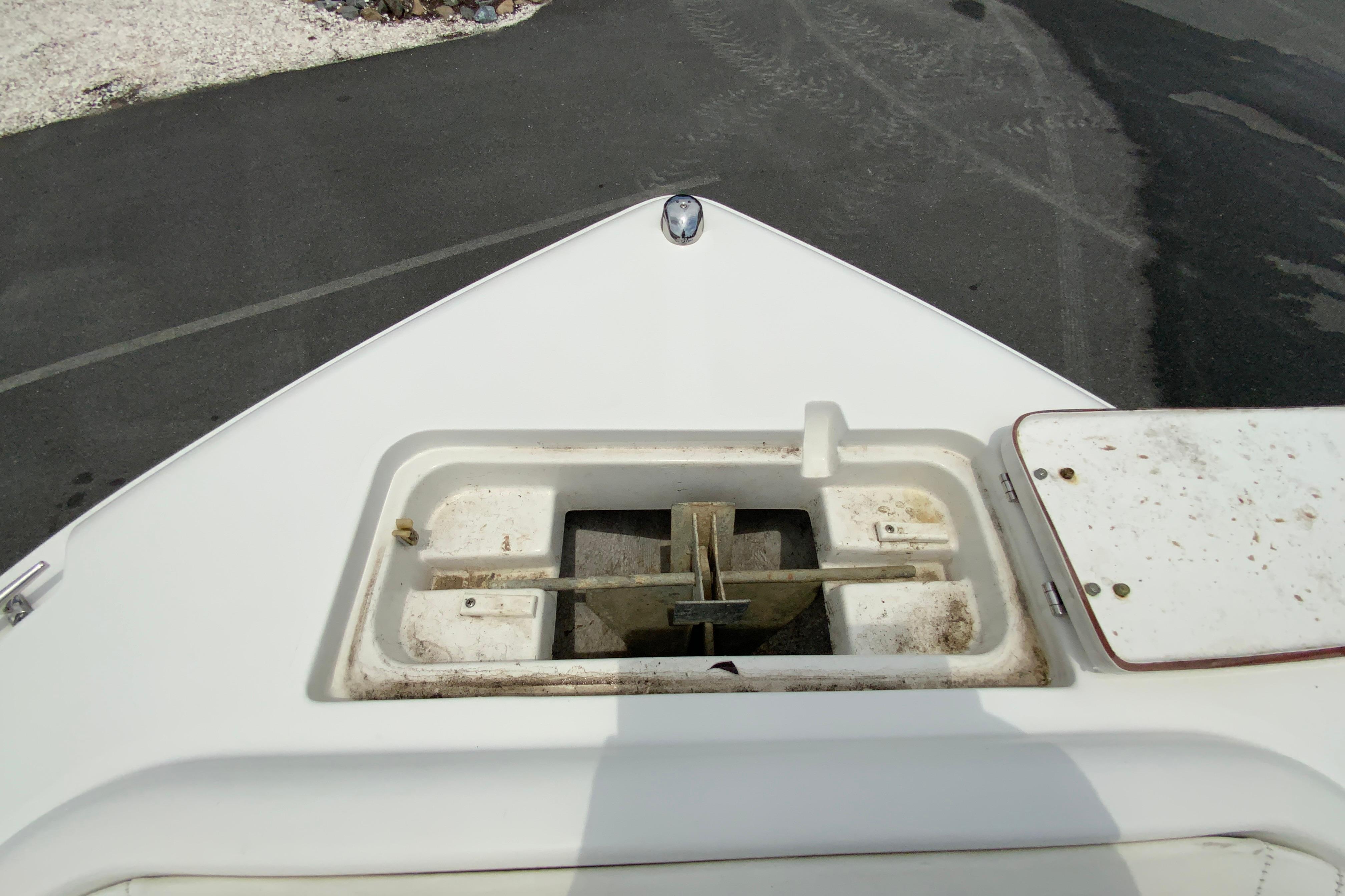 Bow of 2014 Sea Hunt Escape 211 LE with anchor storage compartment.