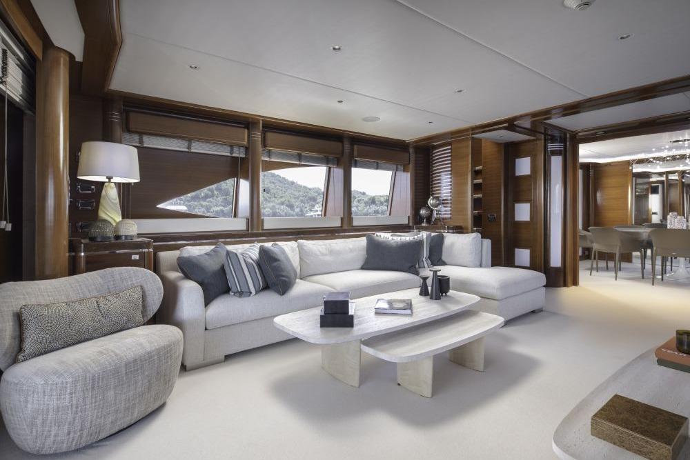 Luxurious interior of 2009 CRN 129 yacht with elegant seating and modern decor.