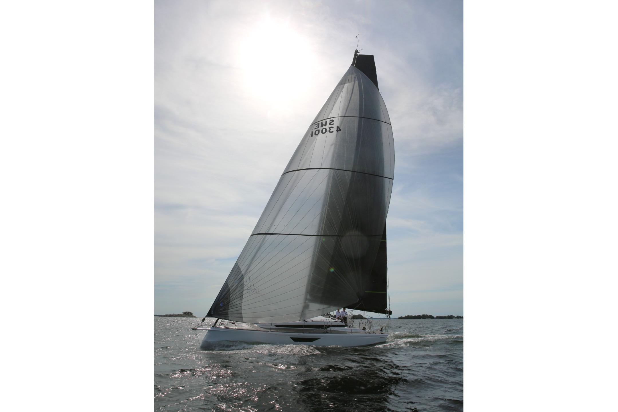 Sailing yacht Shogun 43, 2025 model, gliding on open water under a bright sky.