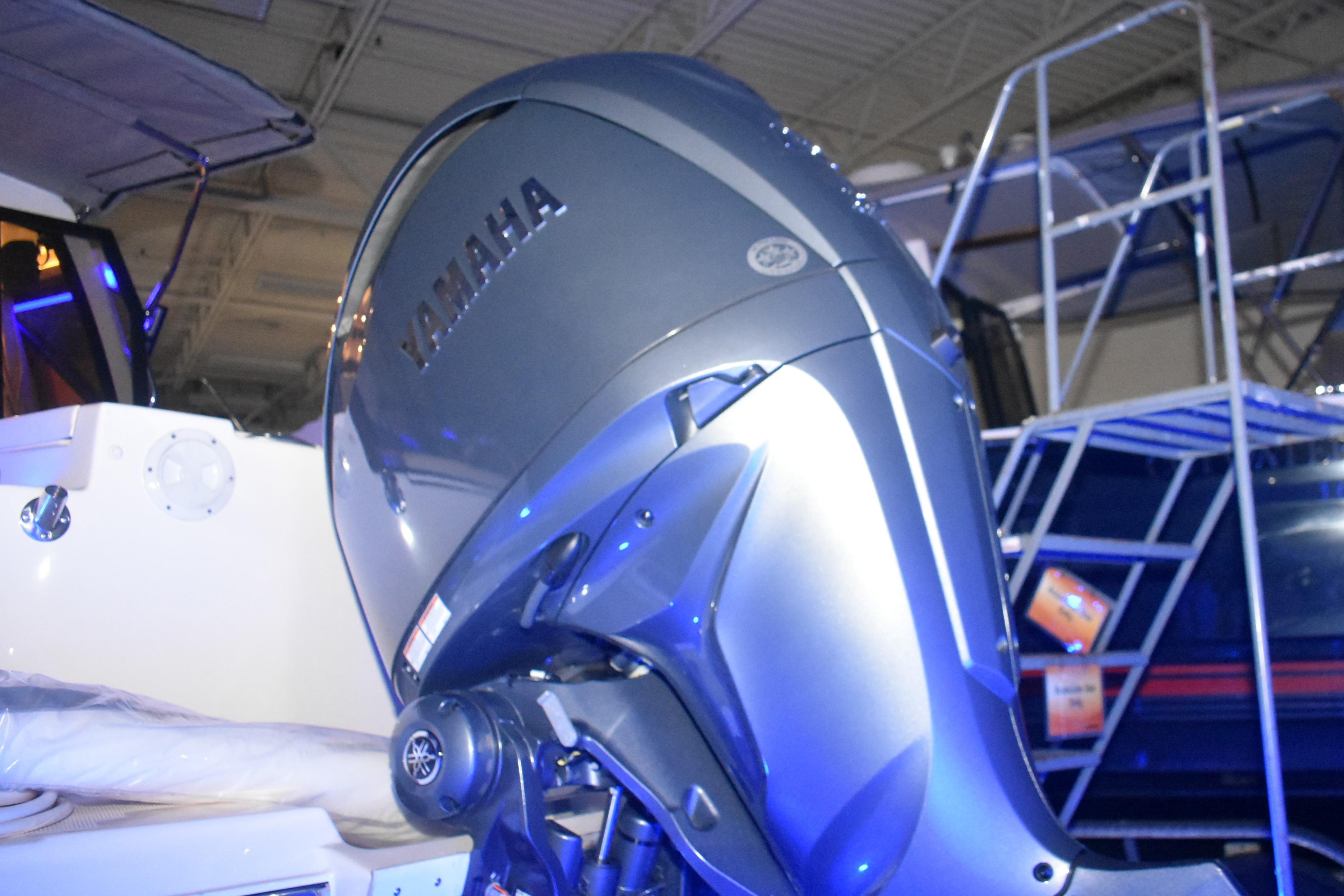 Yamaha outboard motor on 2026 Cutwater C-248 Coupe boat, displayed indoors.