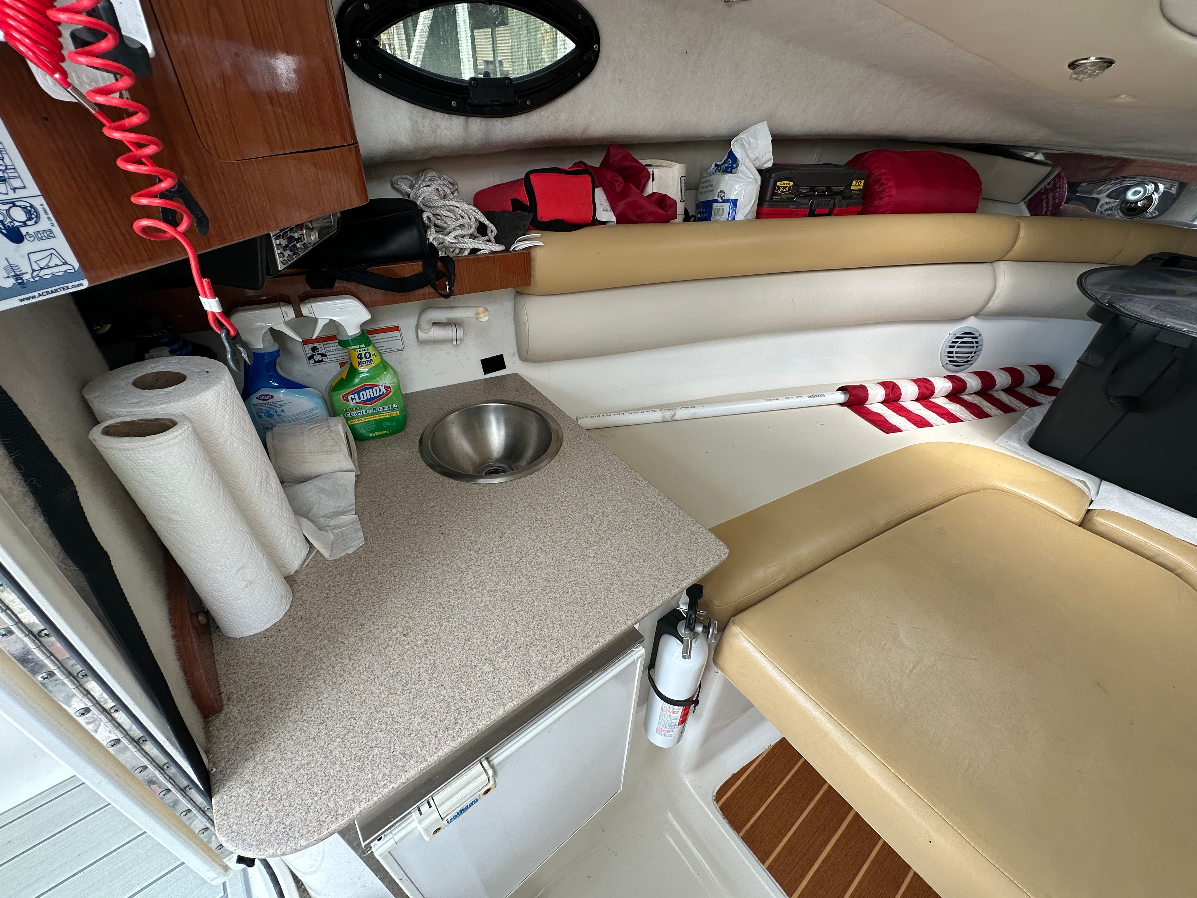 Interior of a 2009 Sea Fox 256WA with a sink and seating area.
