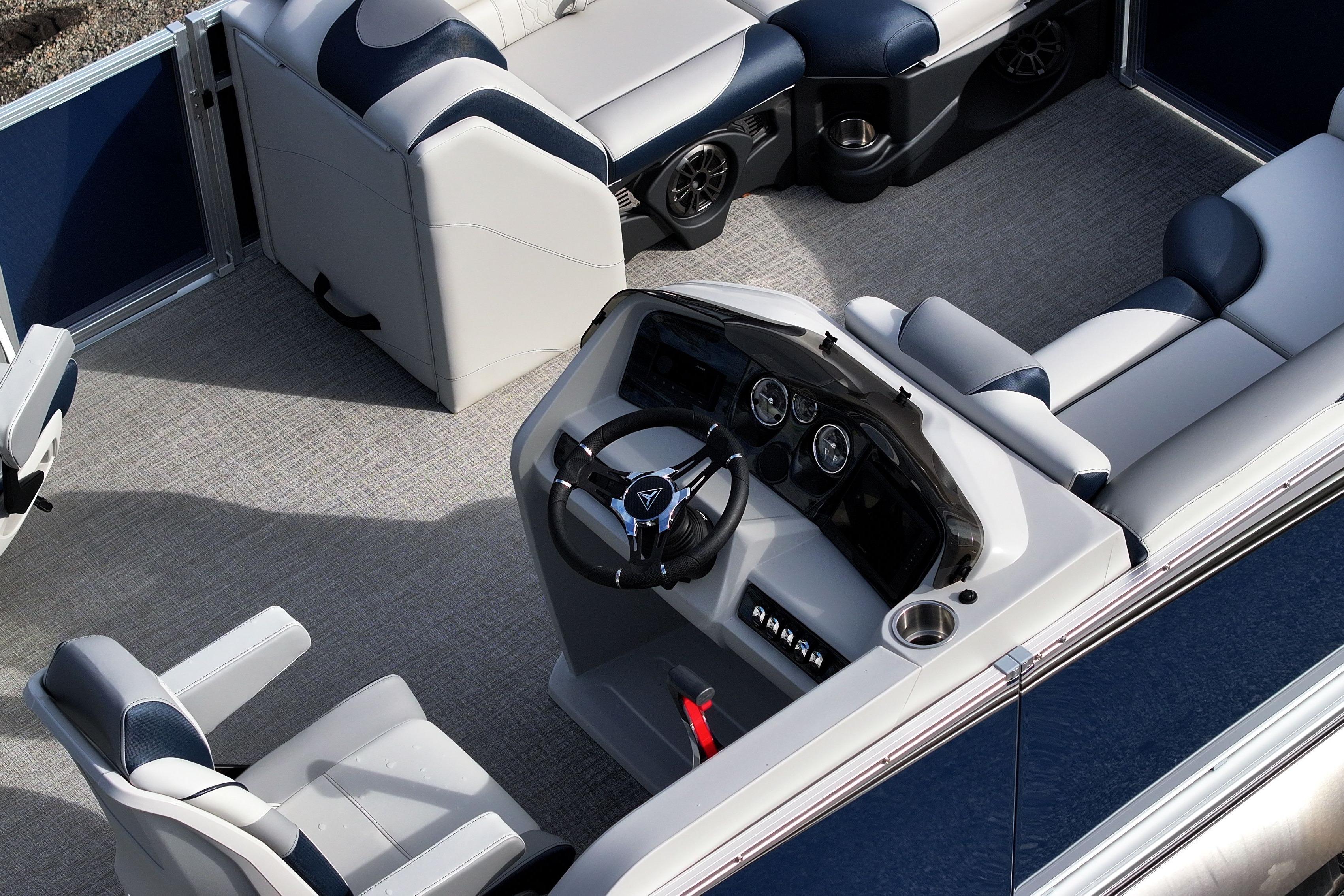 2026 Tahoe Pontoon LTZ Quad Lounger interior with modern seating and steering console.