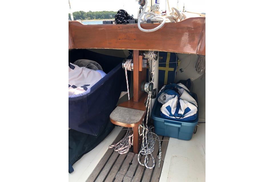 1963 Cape Cod Shipbuilding Shields sailboat interior with ropes and storage.