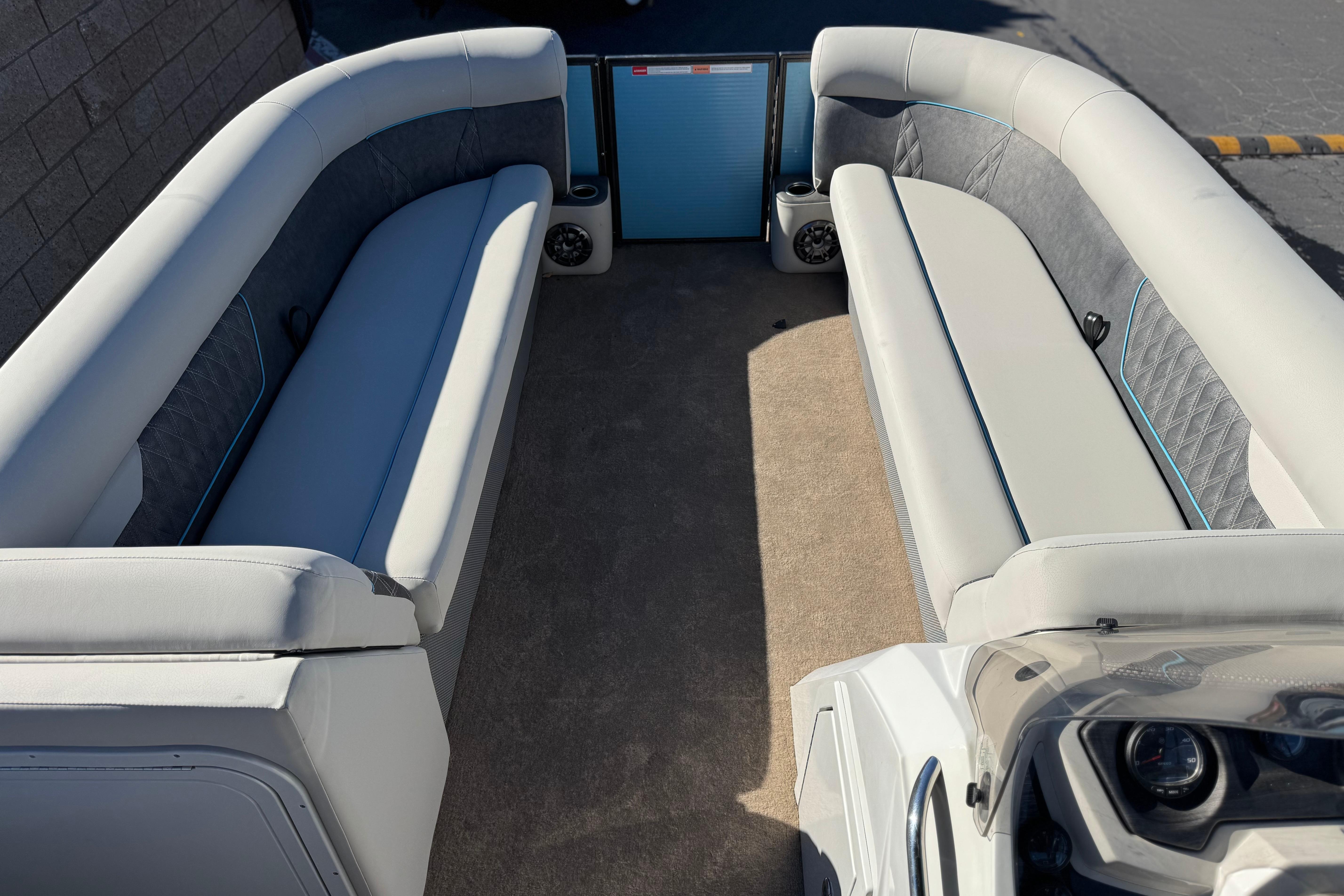 Interior of 2021 Crest Classic Platinum 240 SLC pontoon boat with plush seating.