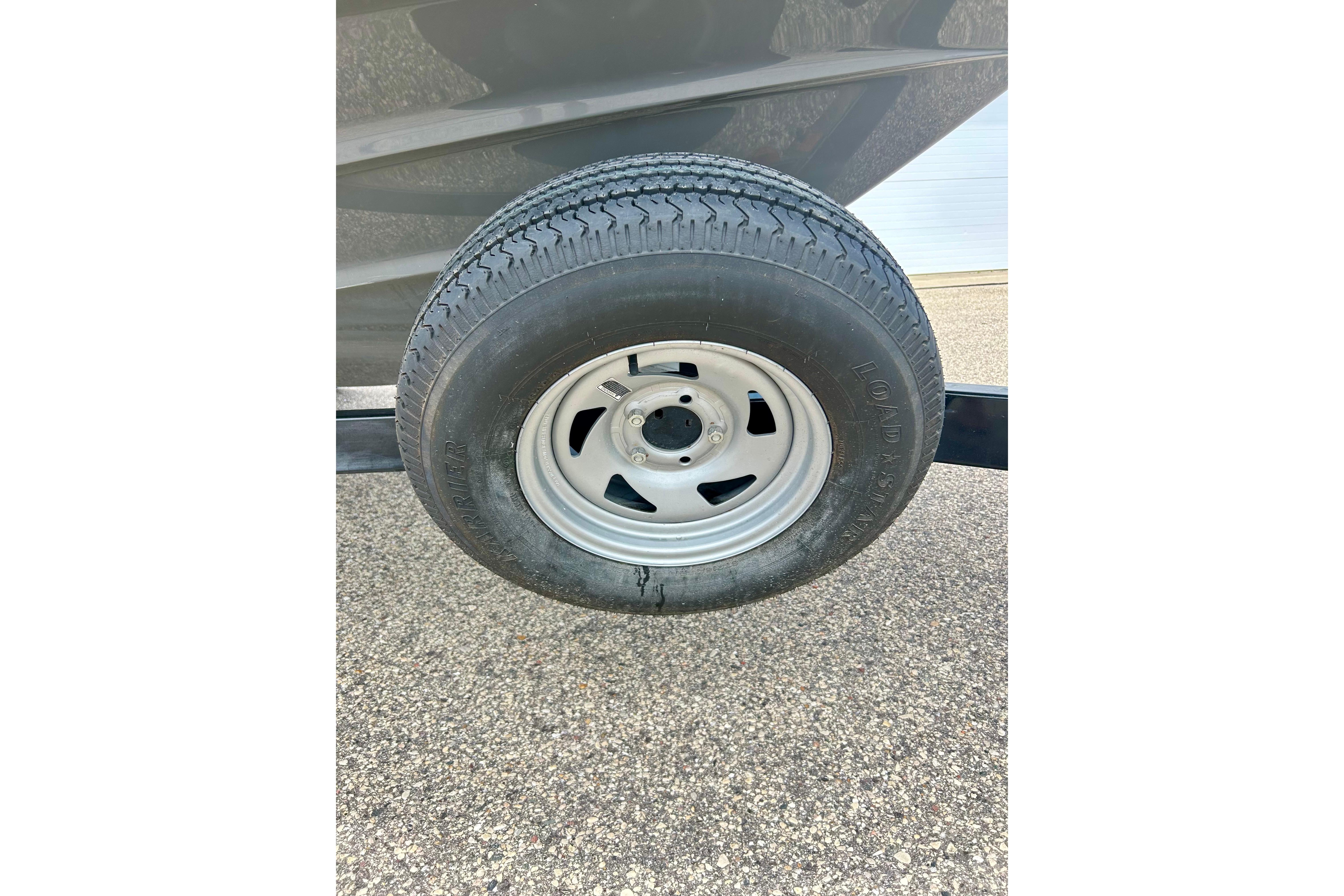 Trailer tire for 2015 Yamaha Boats AR210 on pavement.