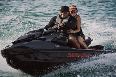 Two people riding a 2026 Sea-Doo GTR-X 300 jet ski on the ocean.