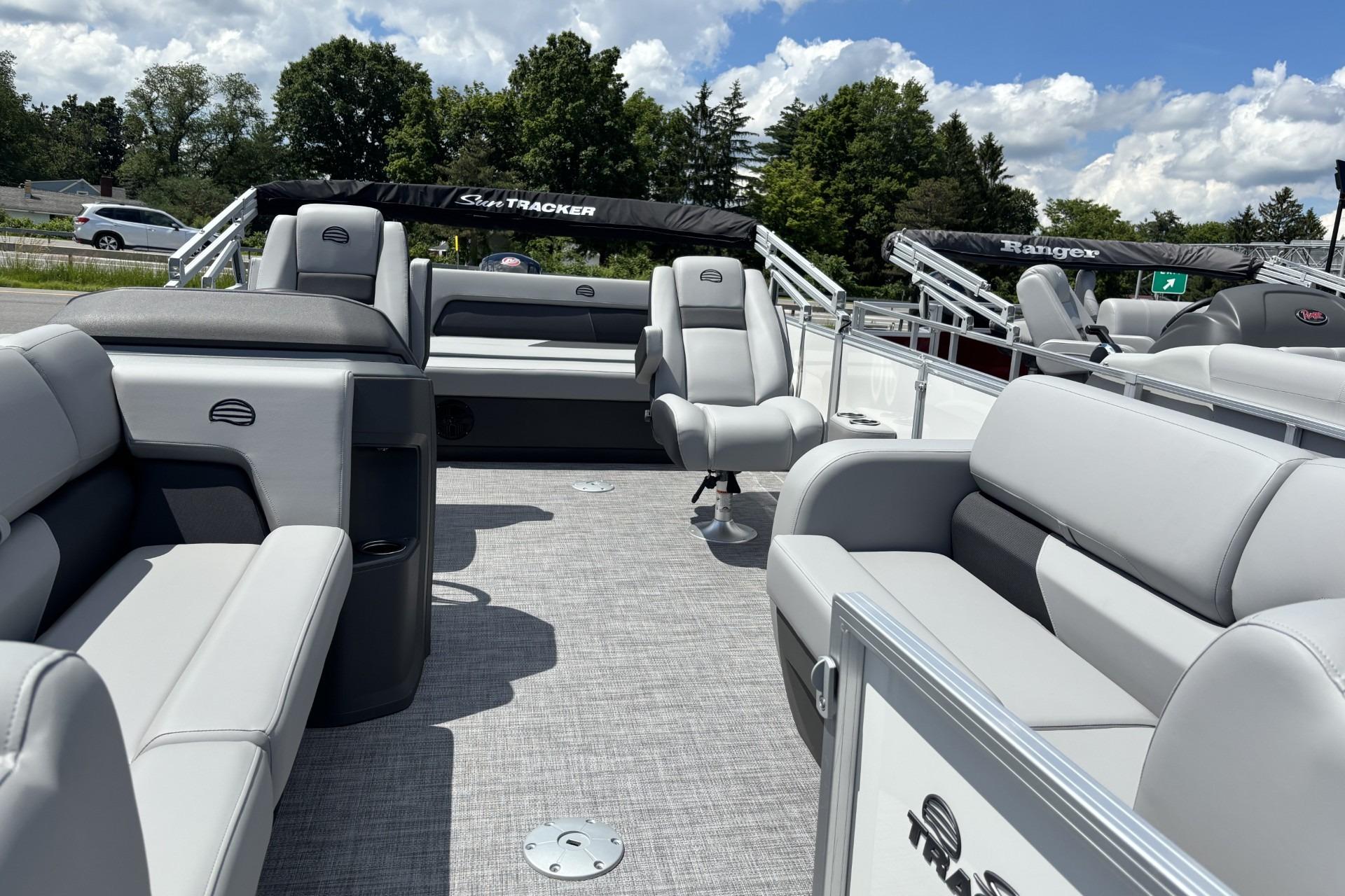 2026 Sun Tracker Party Barge 22 RF DLX interior with plush seating and open deck.