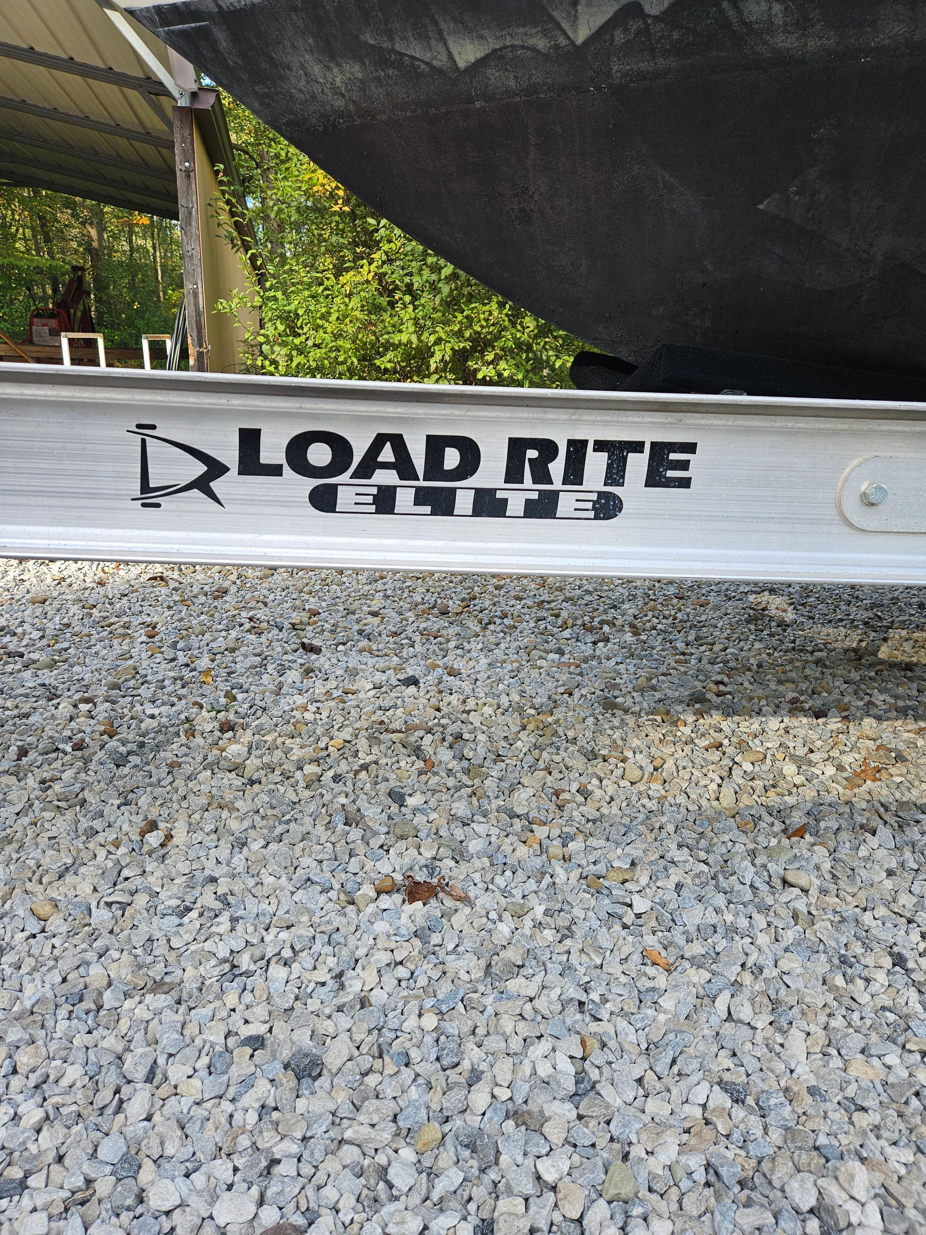 Load Rite Elite boat trailer on gravel surface.