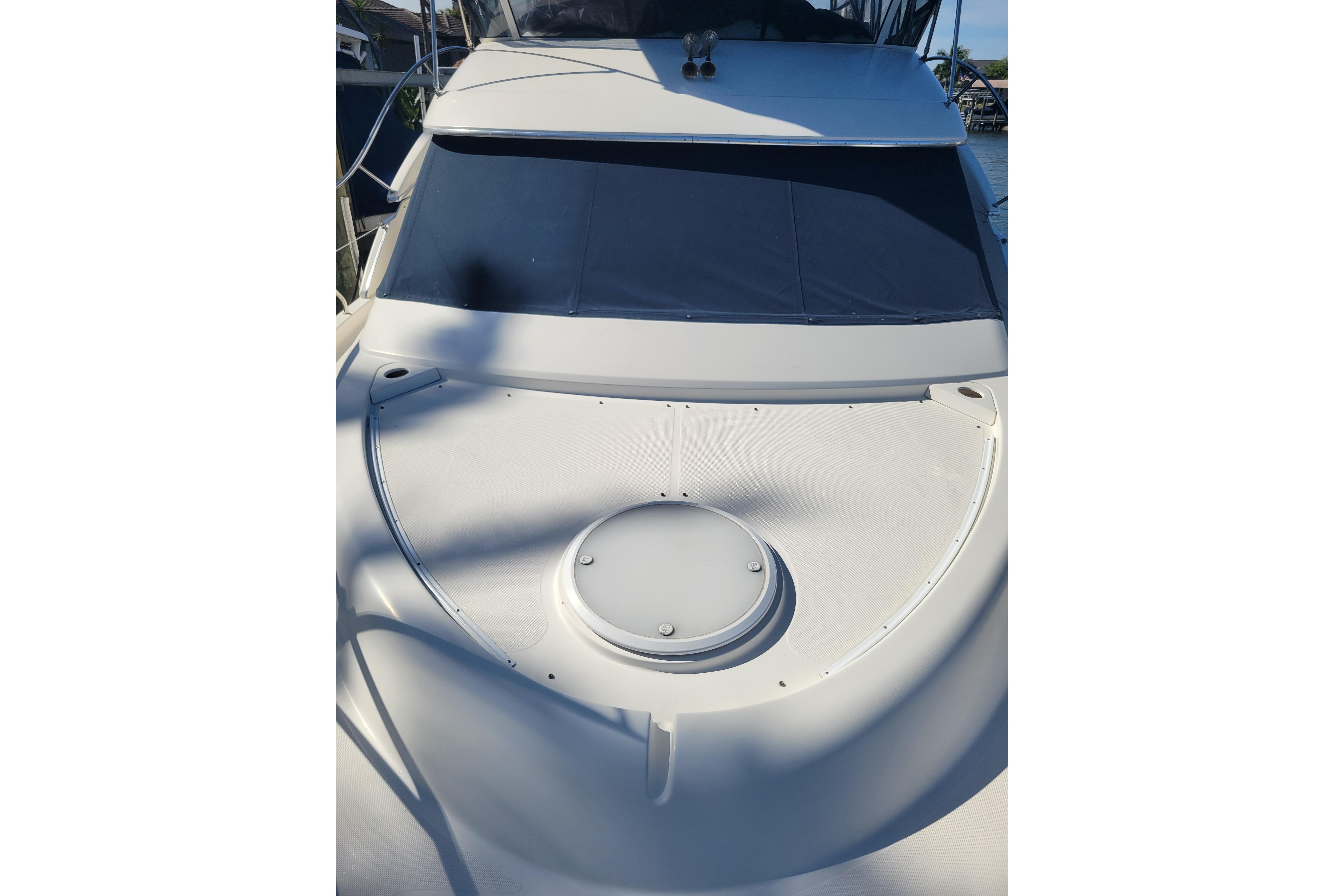 2005 Silverton 43 Motor Yacht bow with sleek design and covered windows.