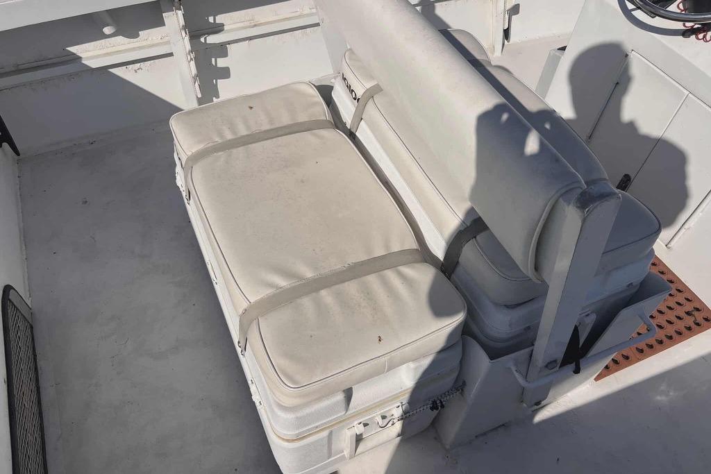 1997 Gravois 20CC boat interior with cushioned seating and storage.