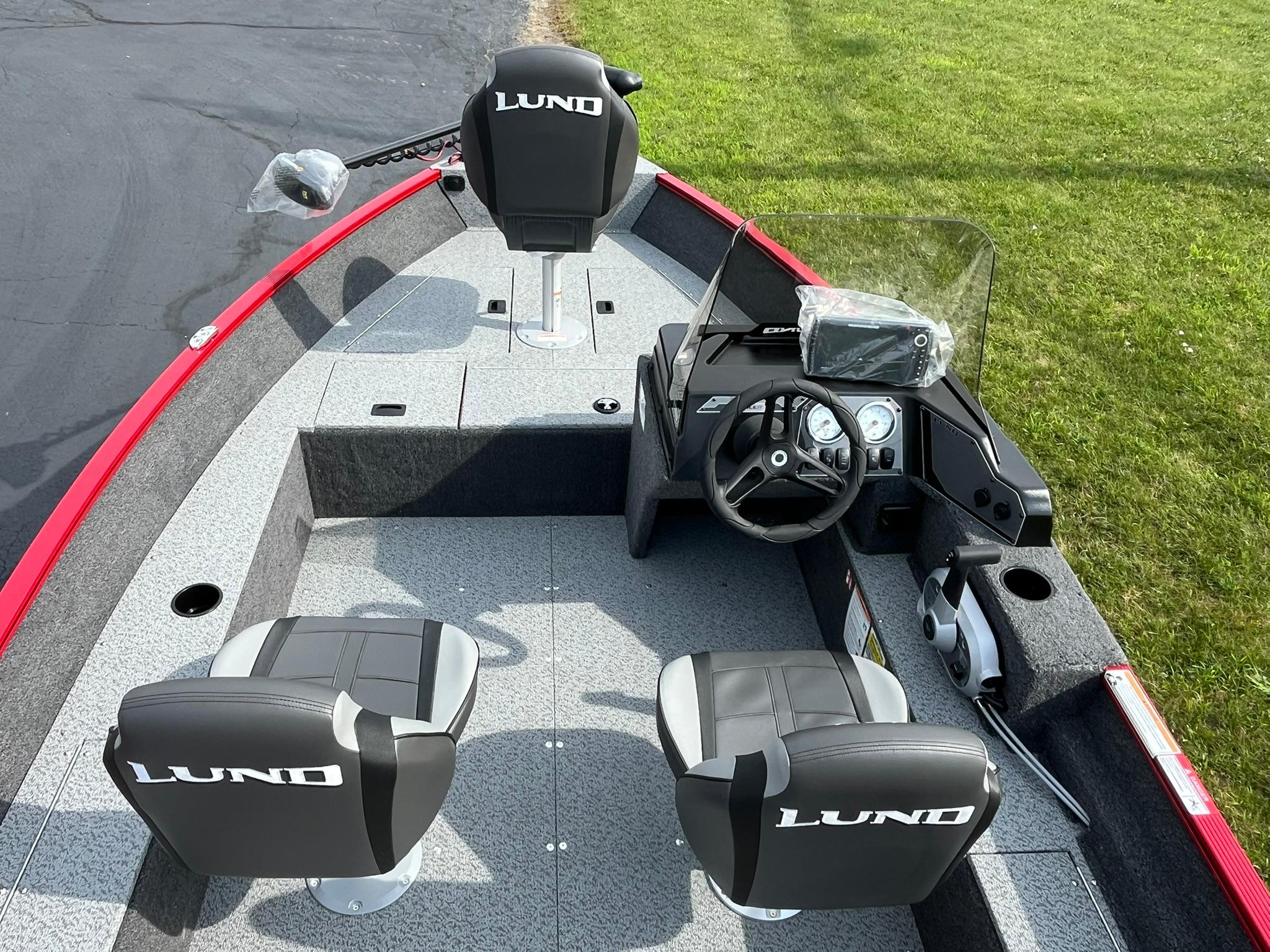 2026 Lund 1650 Angler SS boat interior with steering console and seating.