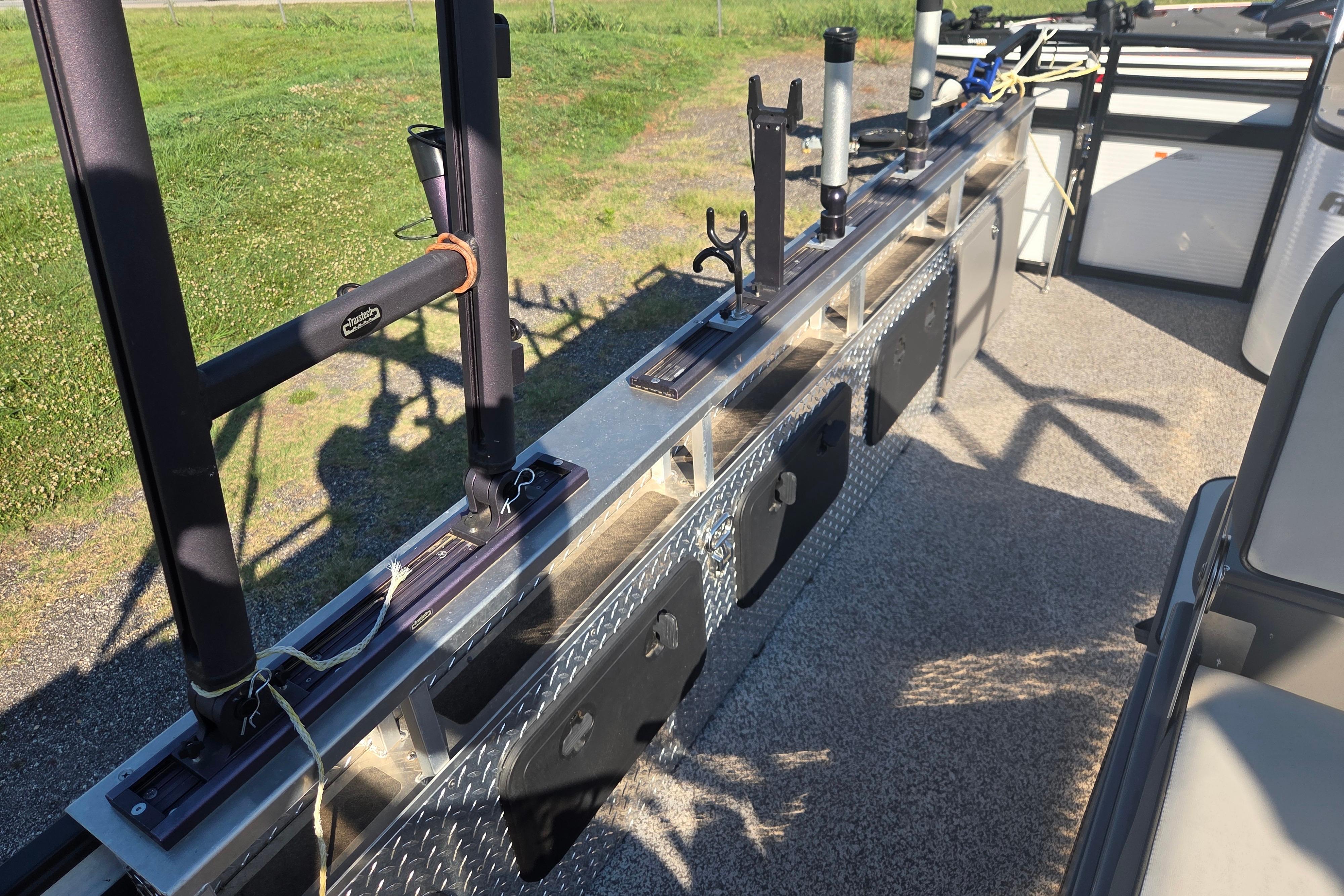 2024 Angler Qwest 8526 Pro Troll fishing rod holders and storage compartments on deck.