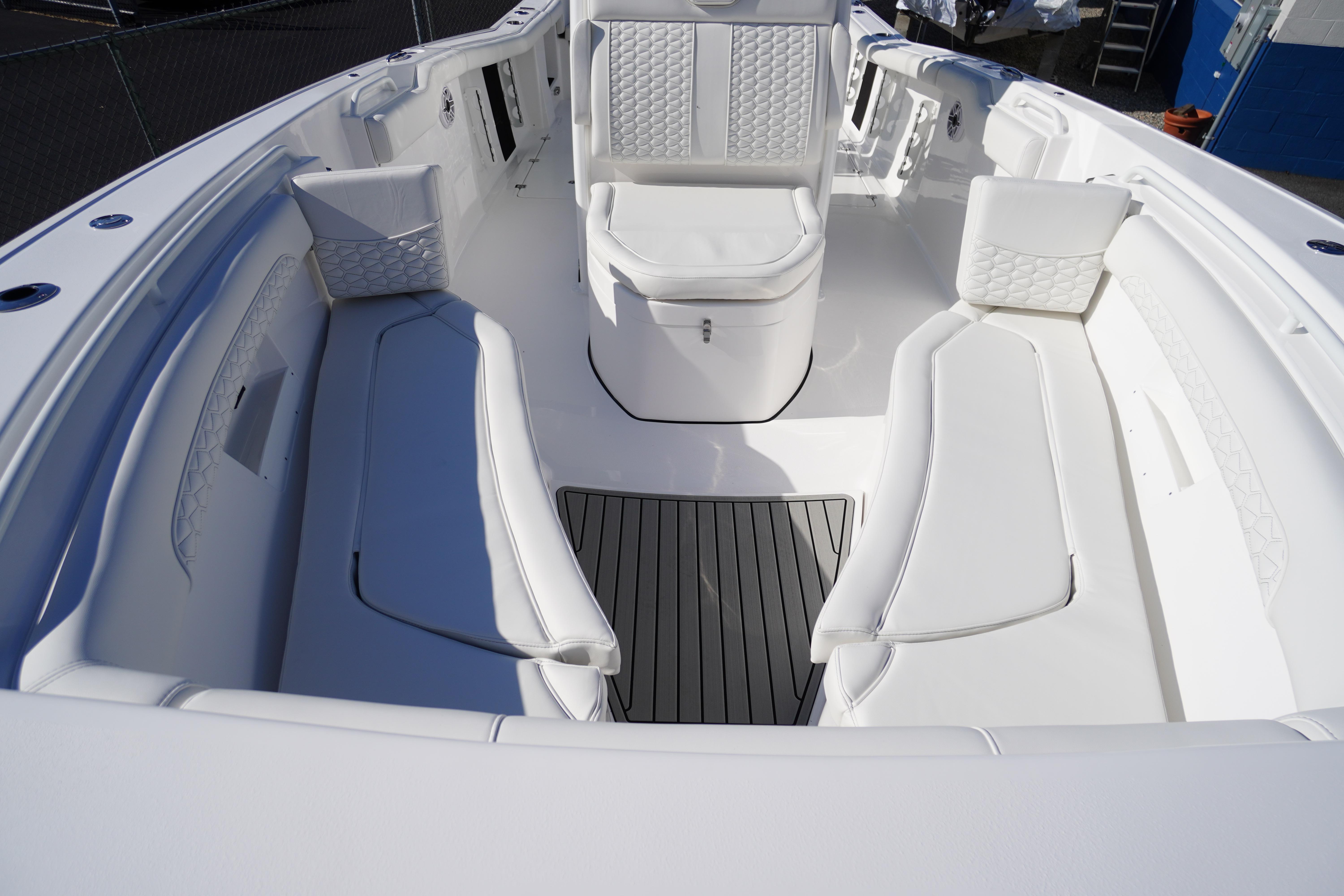 2026 Tidewater 272 LXF boat interior with white seating and sleek design.