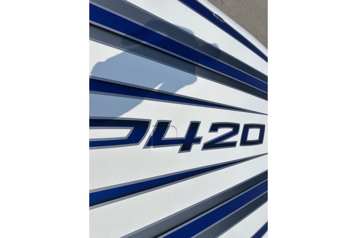 Close-up of Wright Performance 420 boat model, featuring sleek blue and white design.