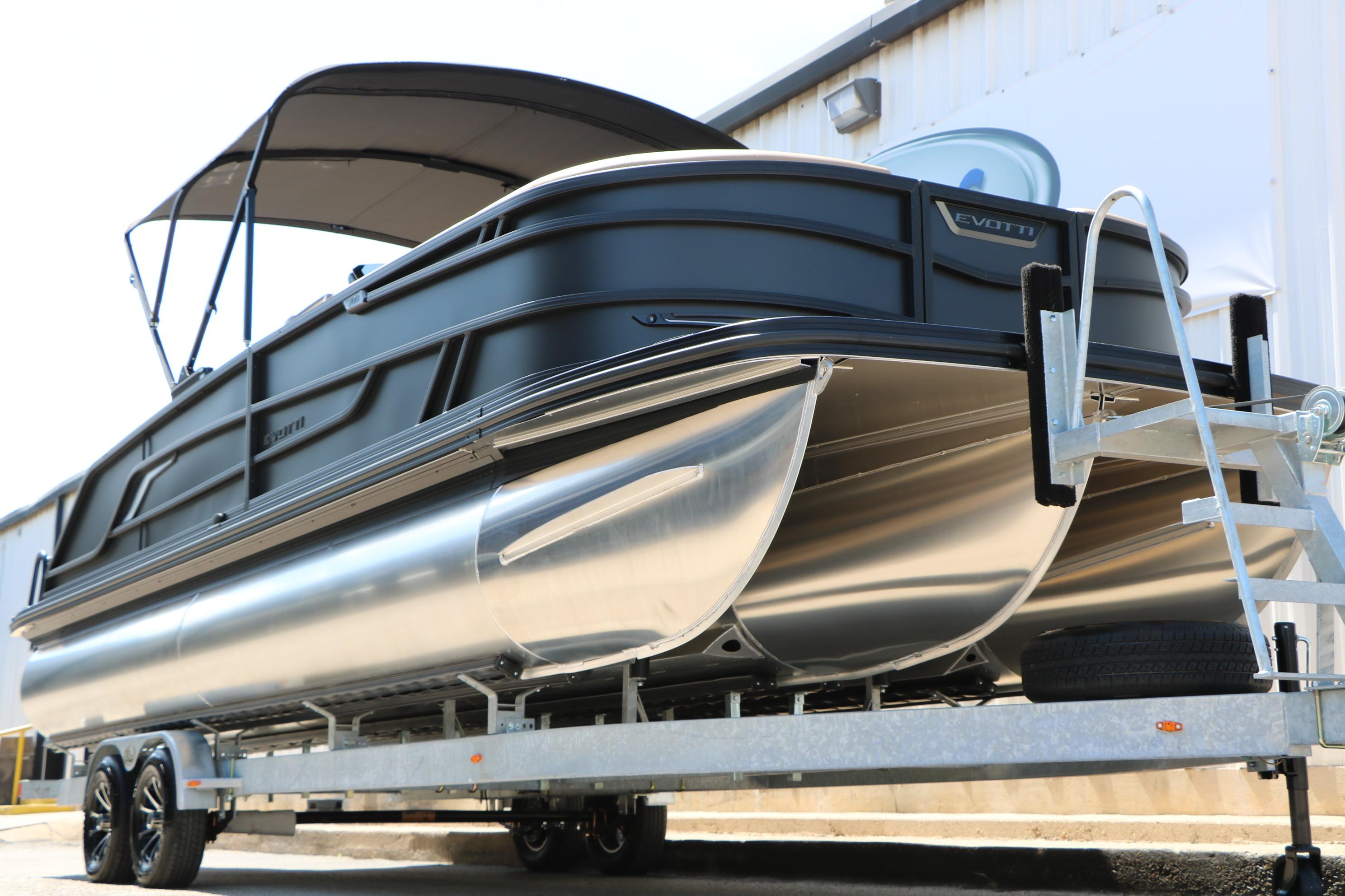 2026 Evotti 725 CS Tri-Toon boat on trailer, featuring sleek design and modern amenities.