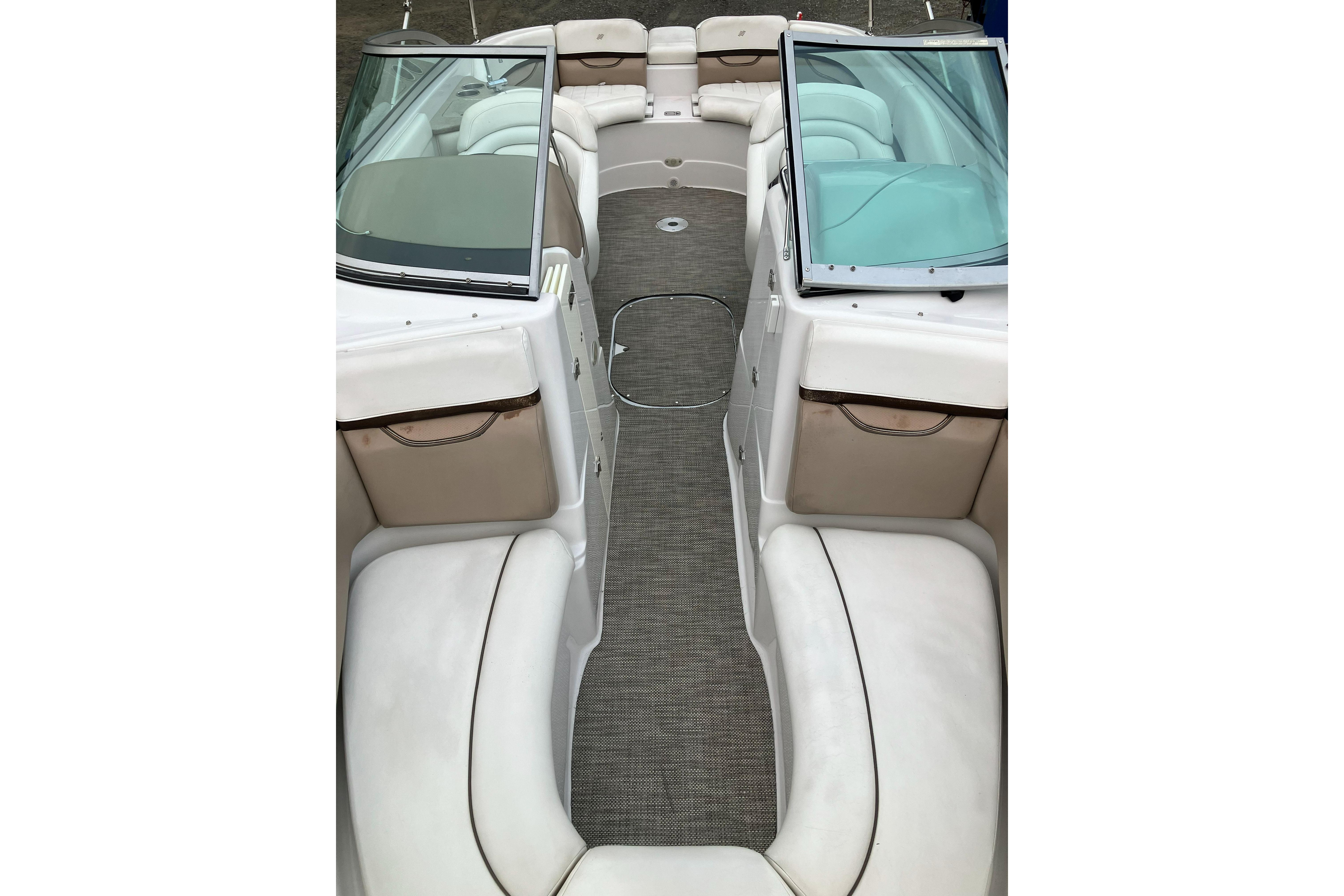 2006 Four Winns 240 Horizon boat interior with white seating and open bow layout.