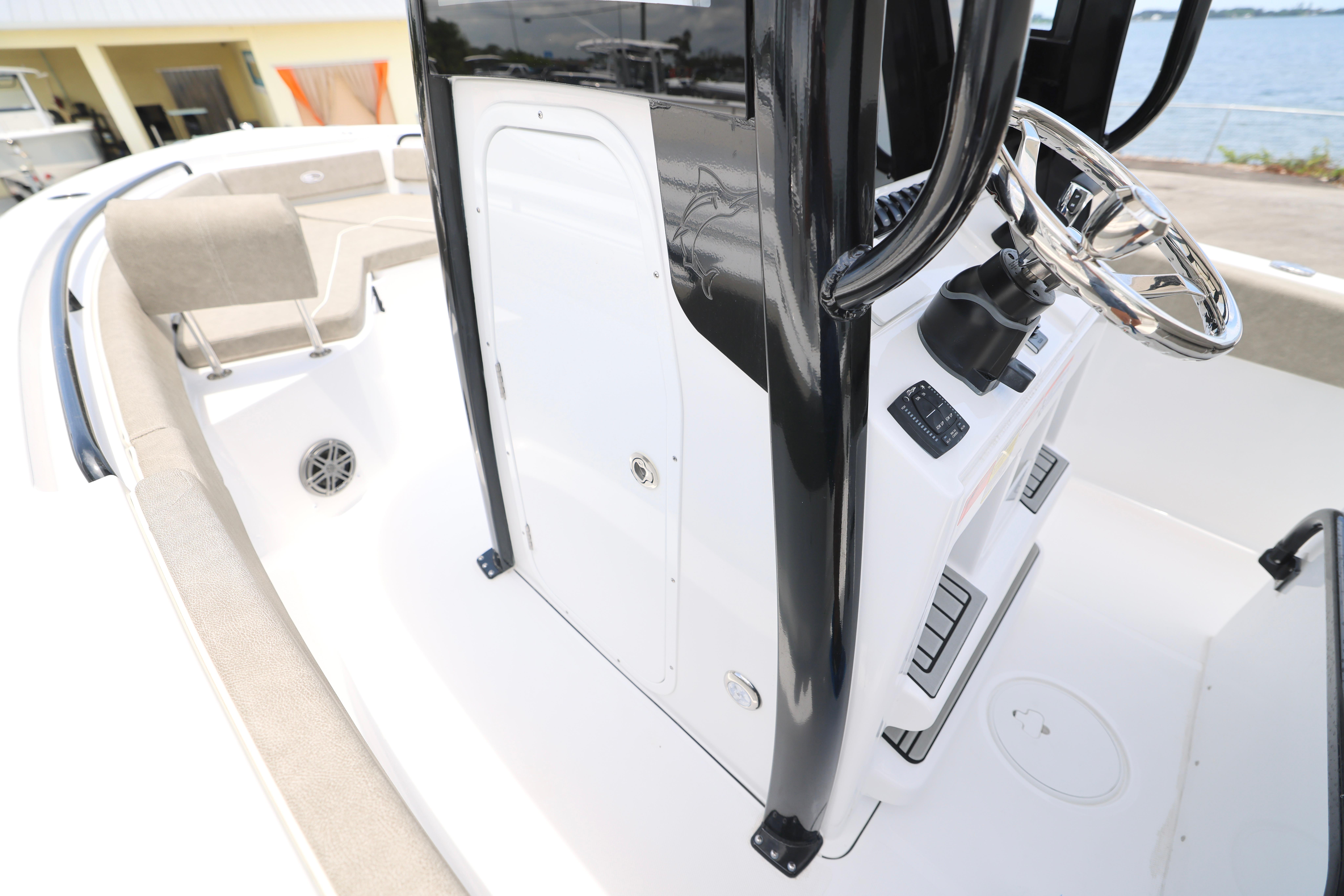 2026 Sea Hunt Ultra 245 SE boat interior with steering console and seating area.