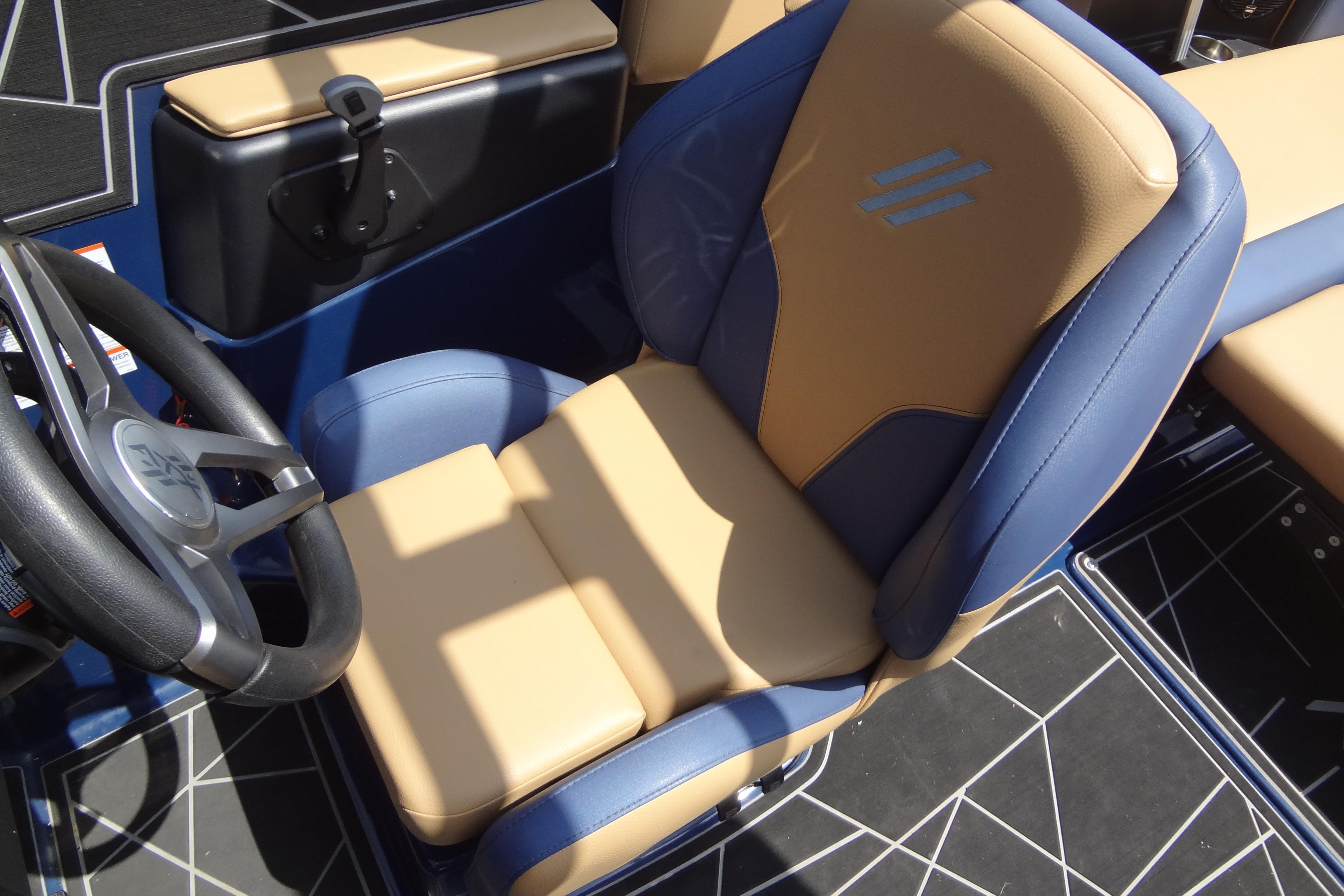 2022 ATX Surf Boats 24 Type-S captain's seat with blue and tan upholstery.