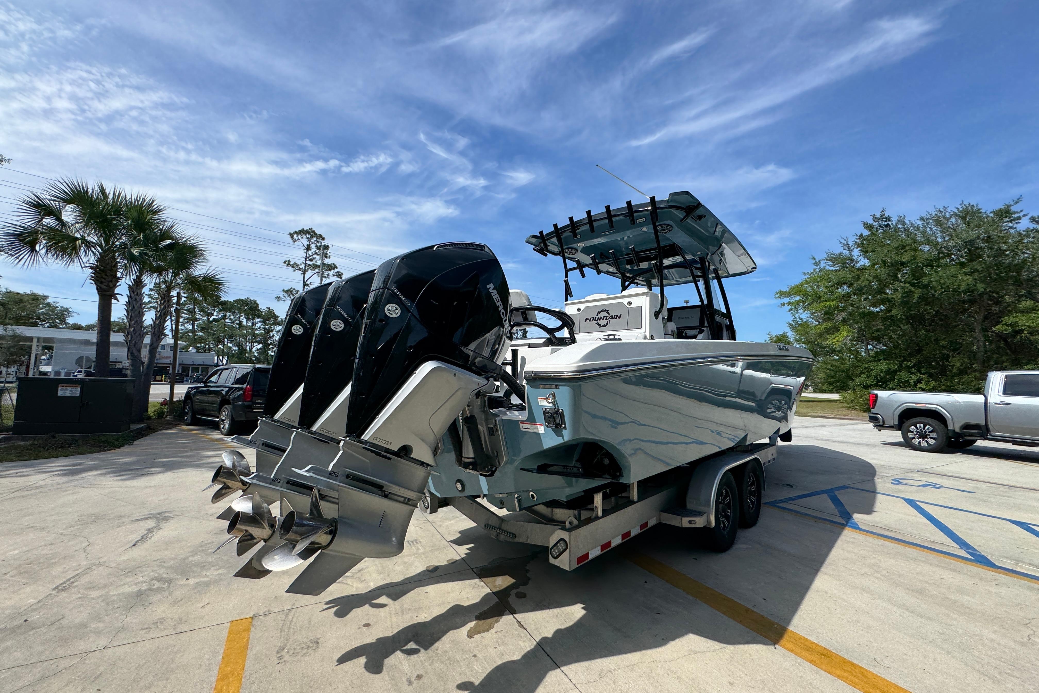 2023 Fountain 34 Tournament Edition boat with triple engines on a trailer.