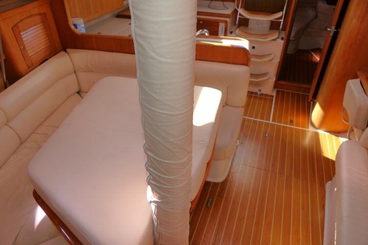 Interior of 2008 Catalina 400 MK II sailboat with wooden flooring and cushioned seating.