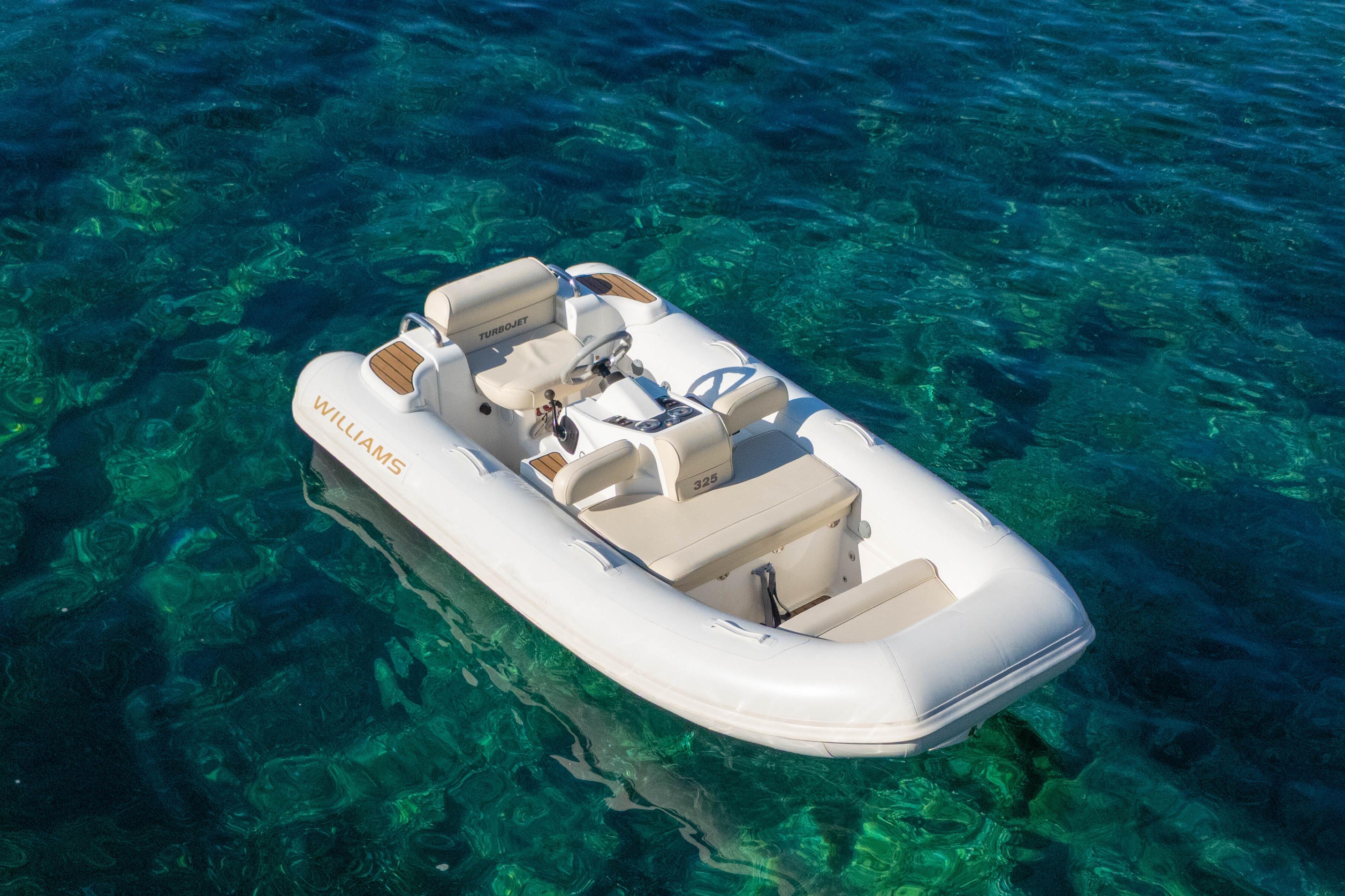 2014 Williams Jet Tenders Turbojet 325 on clear blue water.