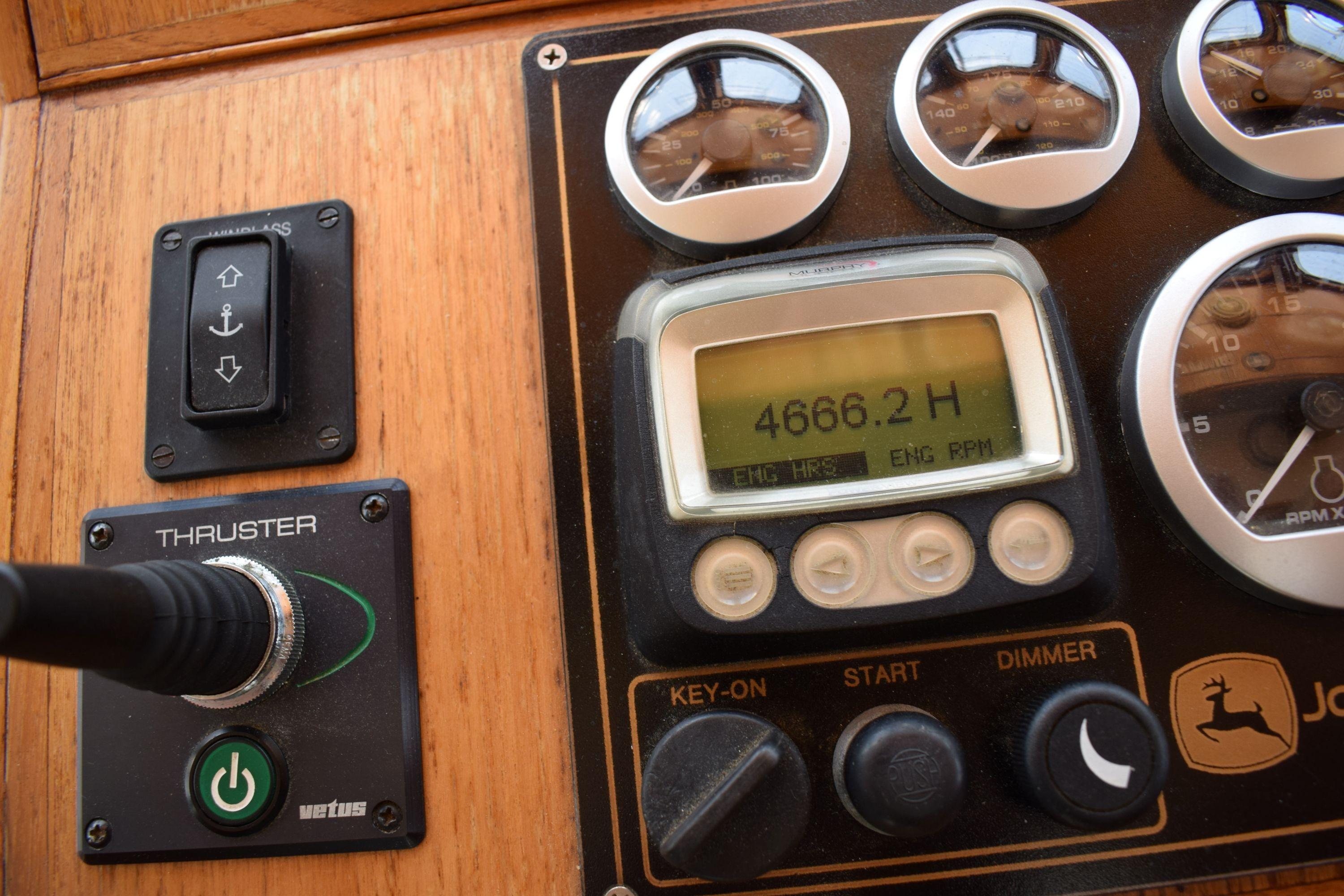 Control panel of a 1980 Cheoy Lee 52 Motorsailer, showing engine hours and gauges.