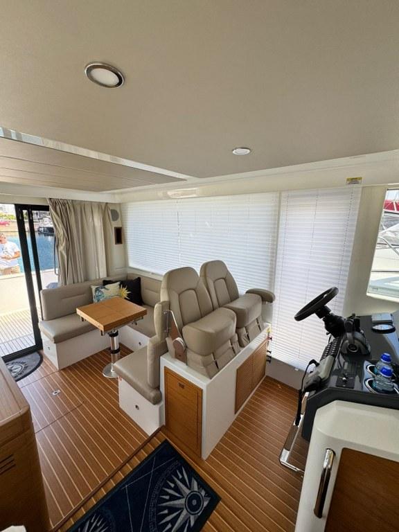 Interior of 2022 Rodman 1290 Evolution yacht with modern seating and helm.