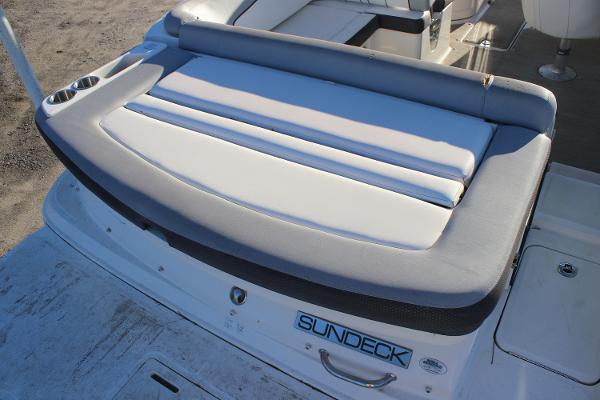 2016 Sea Ray 240 Sundeck boat with cushioned seating and sundeck logo.