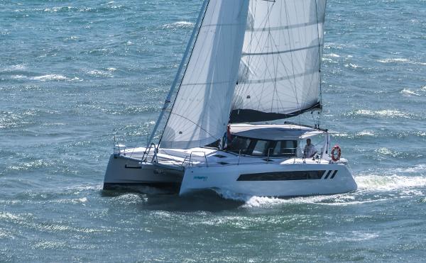 2025 Seawind 1170 catamaran sailing on open water.