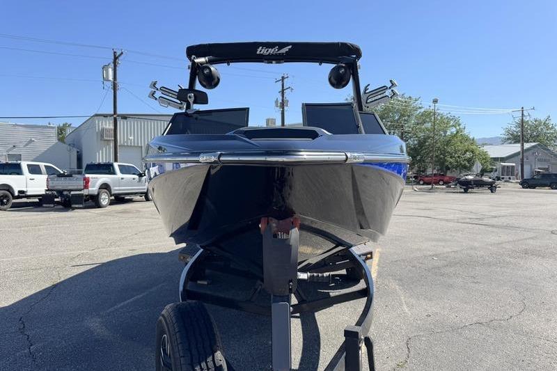 2022 Tigé Z3 boat on trailer in parking lot, front view.