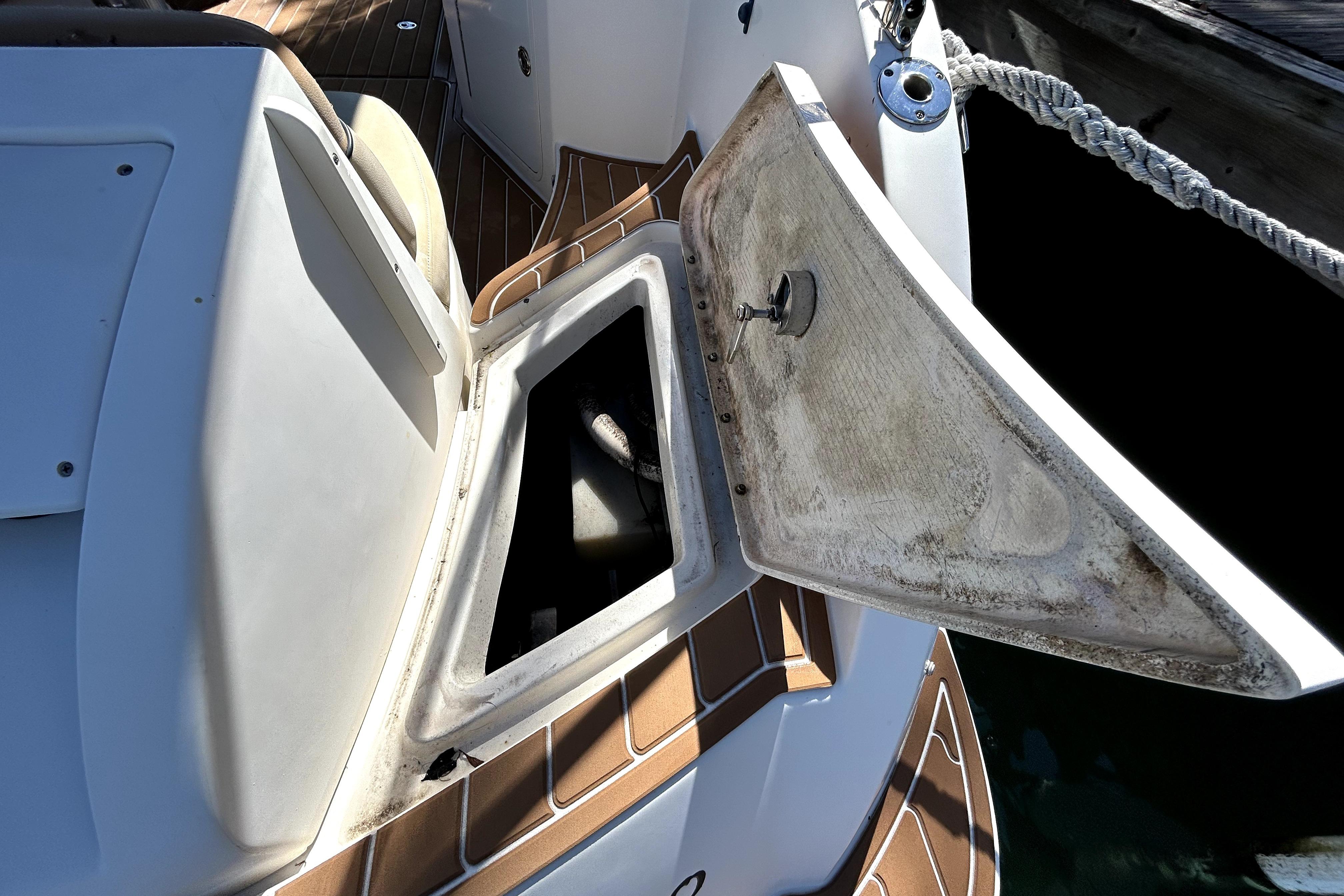 Open storage compartment on a 2007 Sea Ray 260 Sundeck boat.