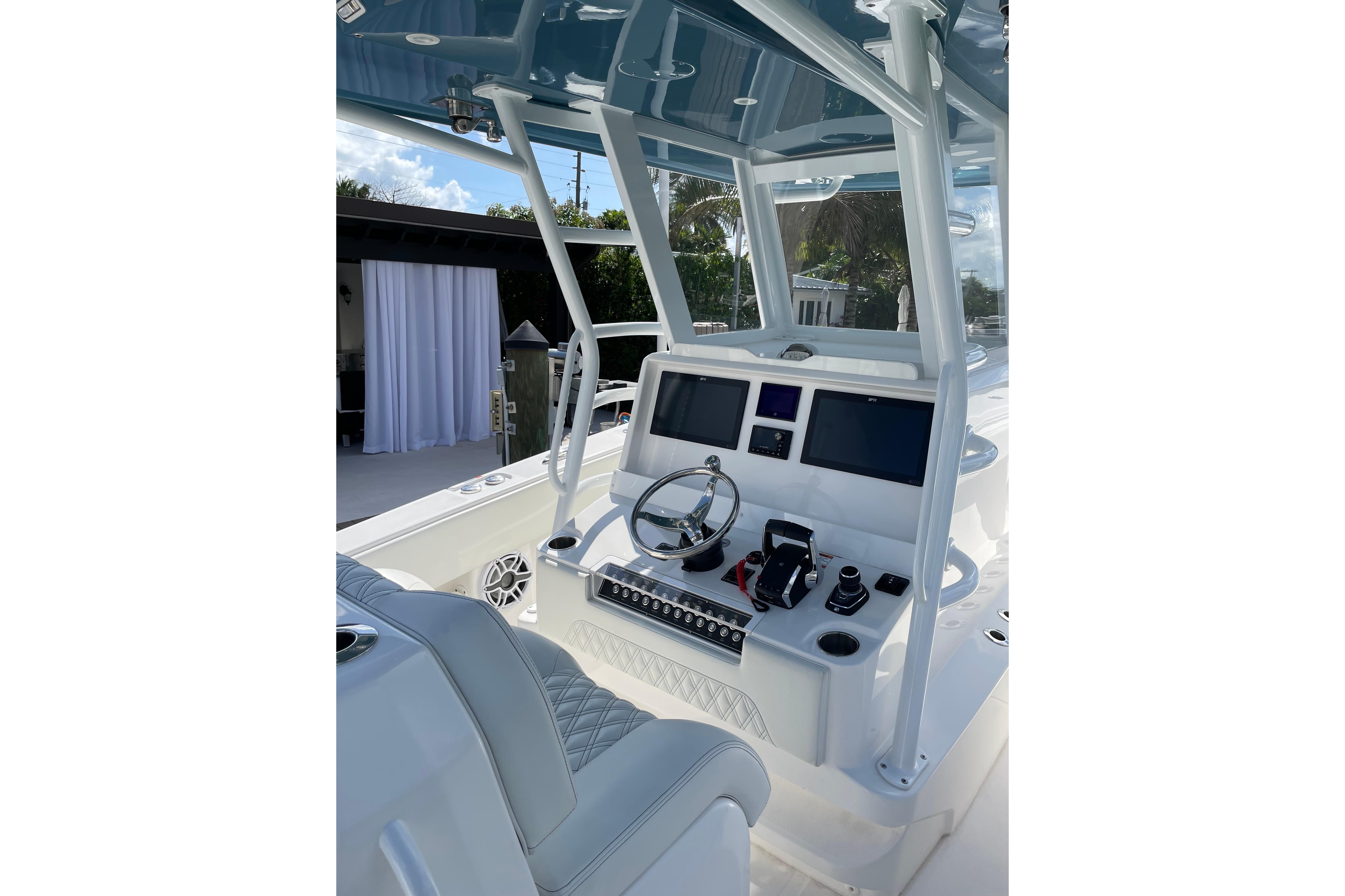 2024 Invincible 36 Open Fisherman boat cockpit with modern controls and dual screens.