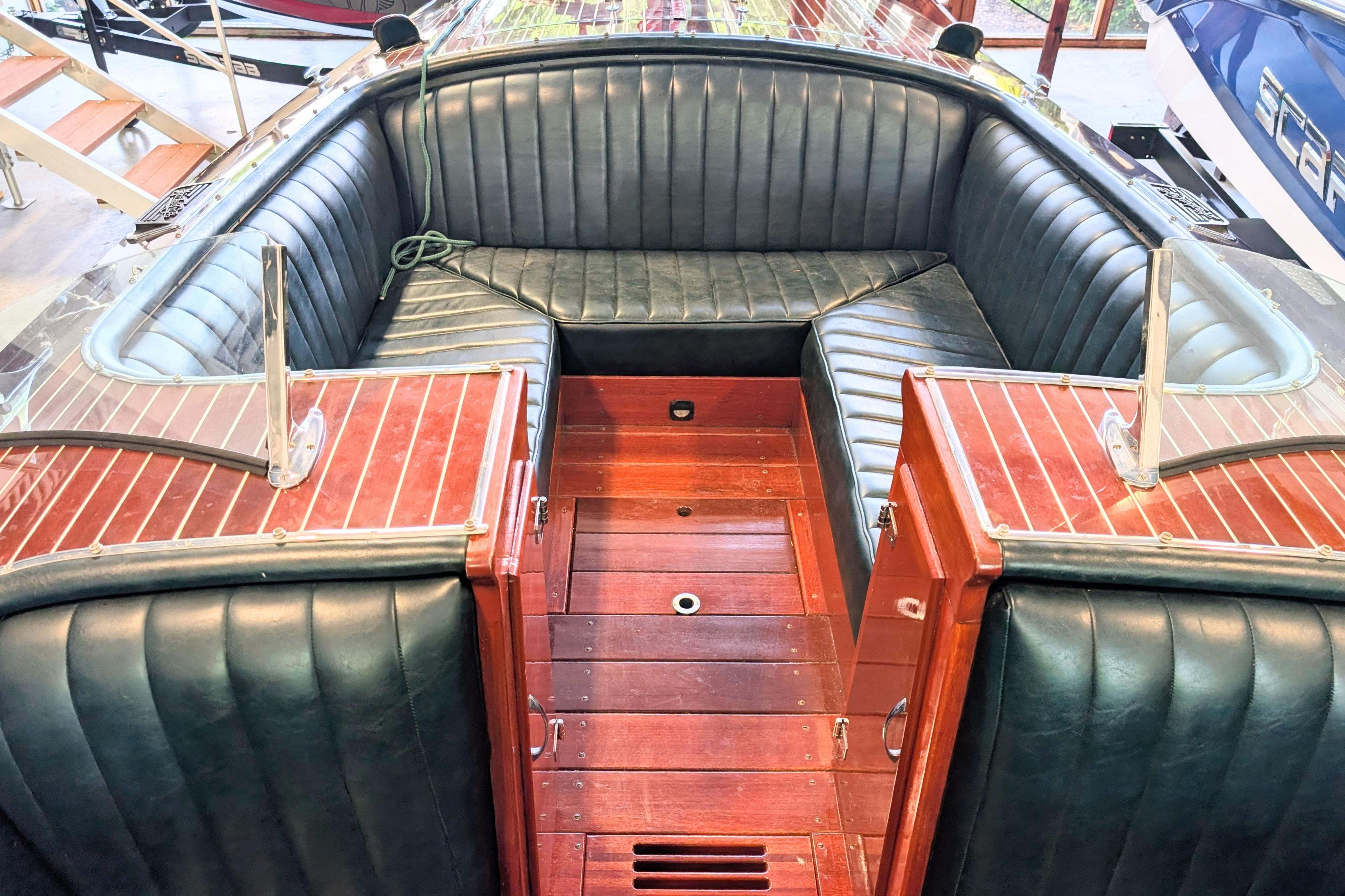 Luxurious 2001 Hacker-Craft 24 Dual Console boat interior with elegant leather seating.