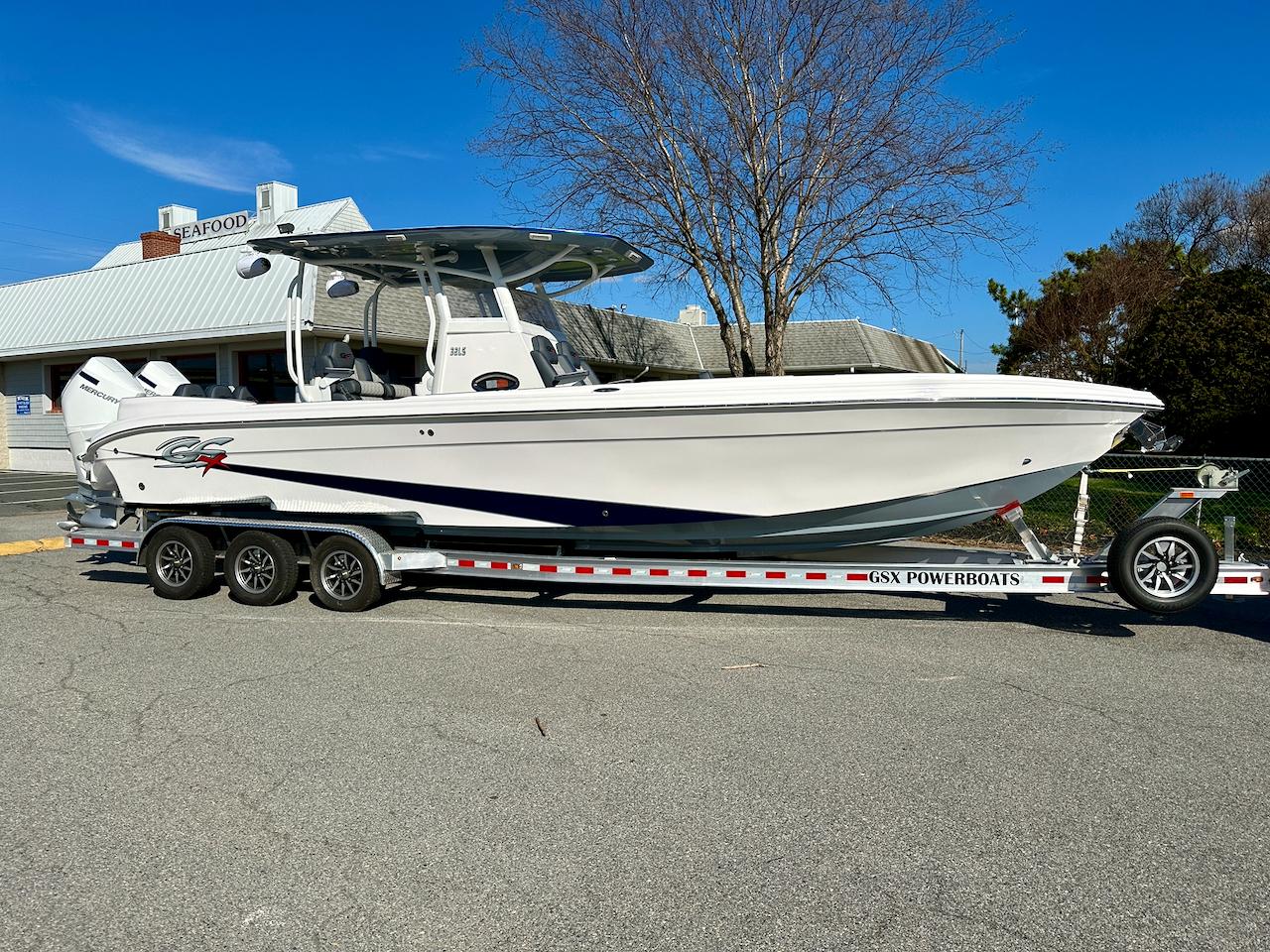2024 Glasstream 32 GSX boat on a trailer in a parking lot.
