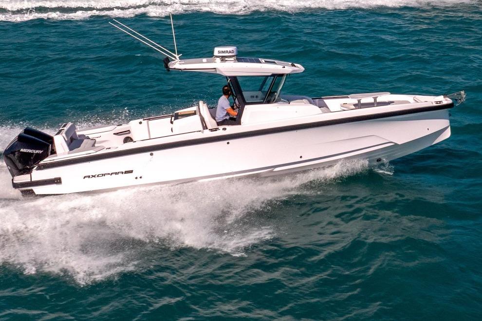 2025 Axopar 29 CCX boat cruising on open water, showcasing sleek design and performance.