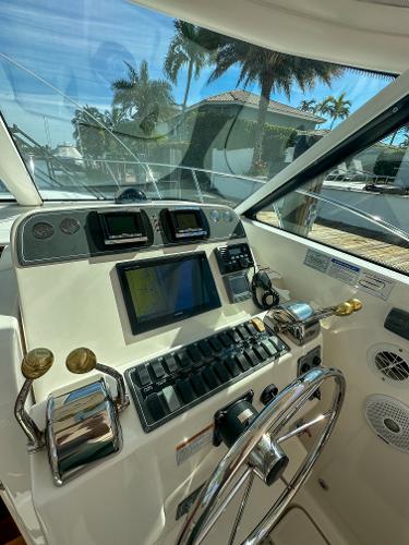 2006 Tiara Yachts 3200 Open helm with modern navigation equipment and controls.