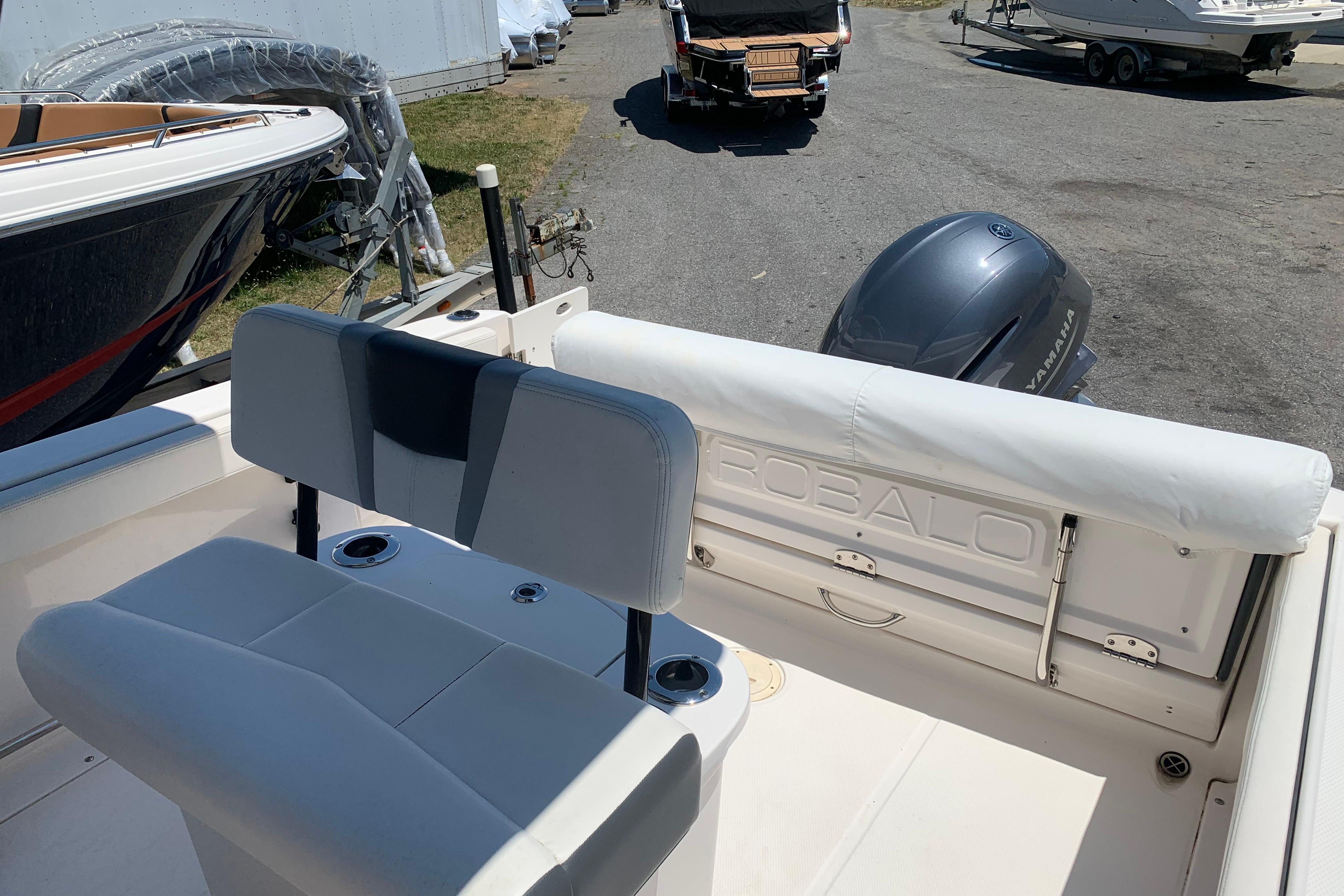 2023 Robalo R222 Center Console boat interior with seating and Yamaha engine.
