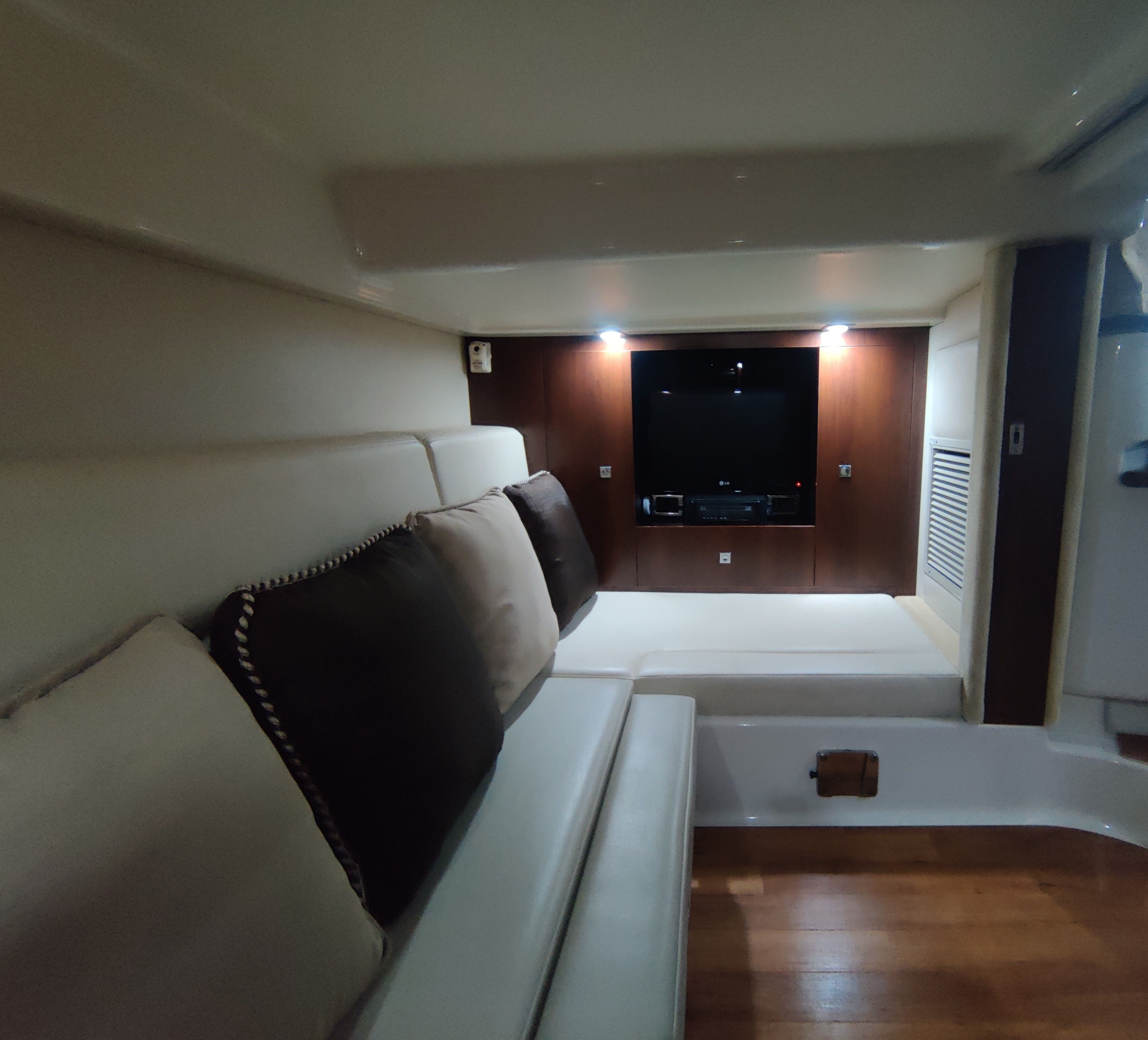 Interior of 2014 Chaparral 330 Signature with cozy seating area.