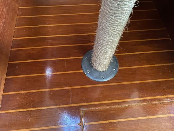 Polished wooden floor with a wrapped post, Hunter 31 sailboat, 1984 model.