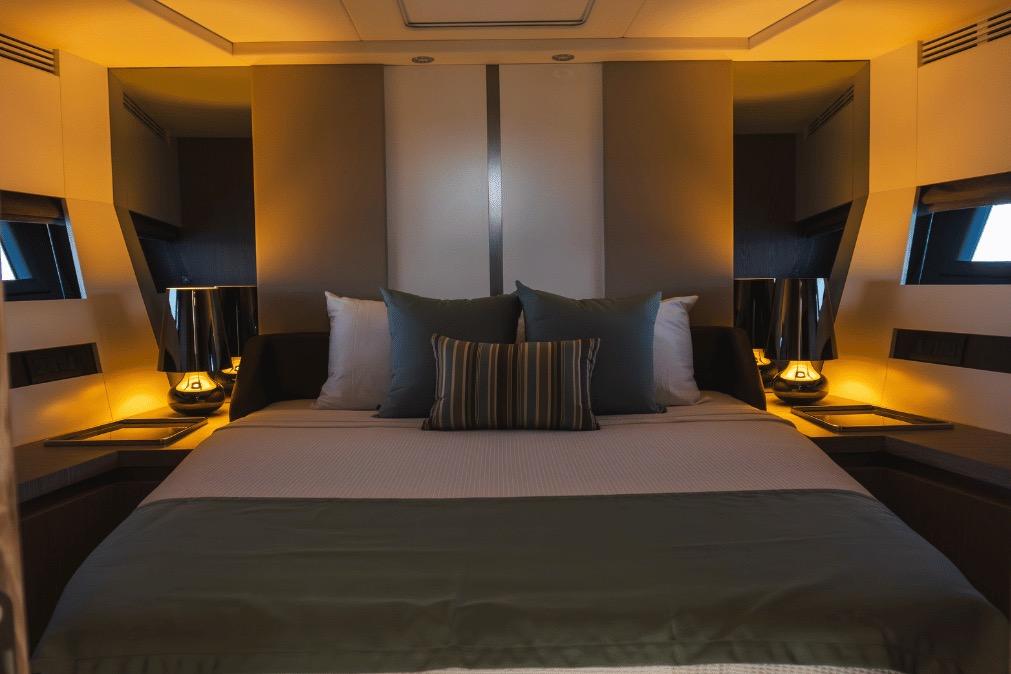 Luxurious bedroom interior of 2020 Azimut 60 yacht with elegant lighting and modern decor.