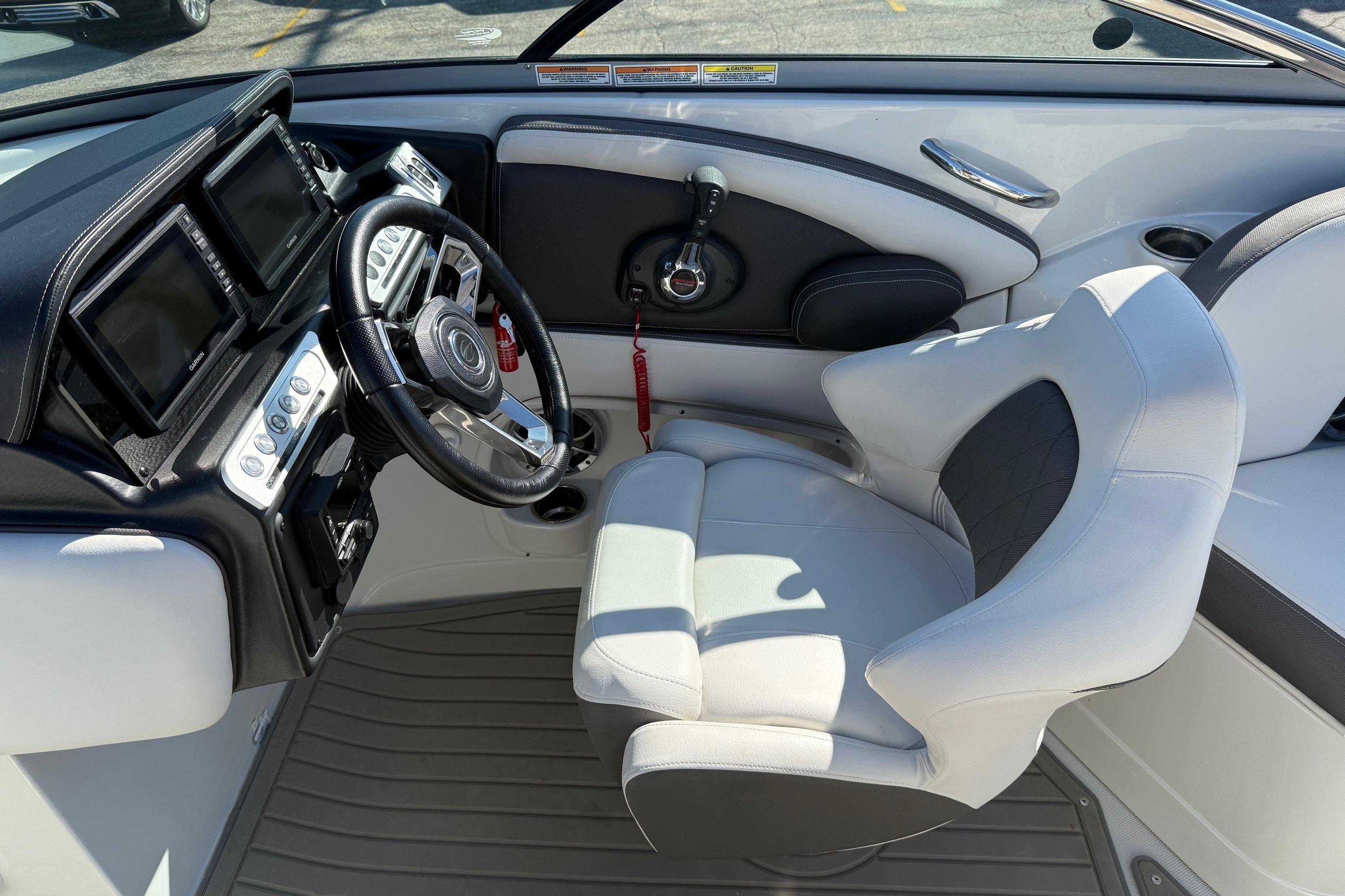 2023 Crownline 290 SS boat cockpit with modern steering and controls.