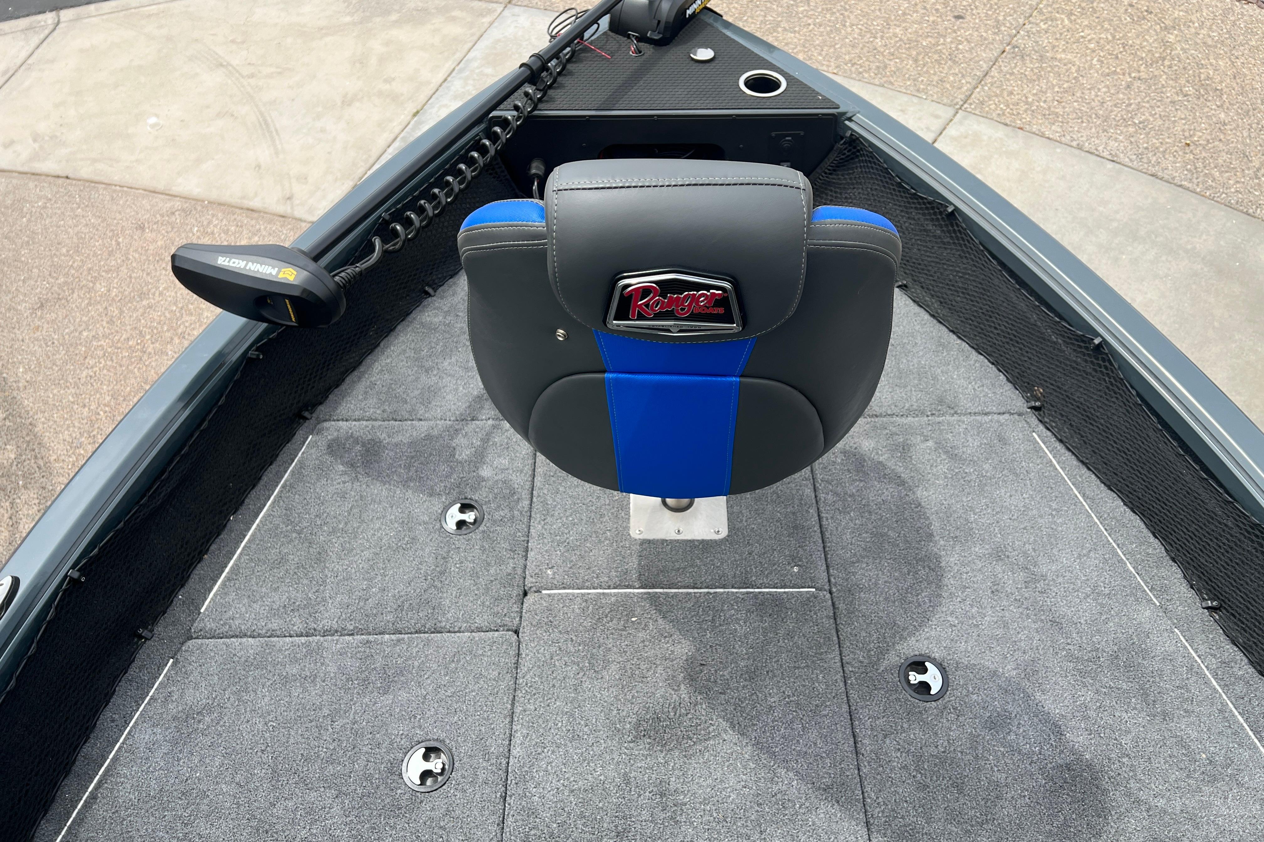 2026 Ranger VS1682SC Angler boat interior with gray carpet and blue-accented seat.