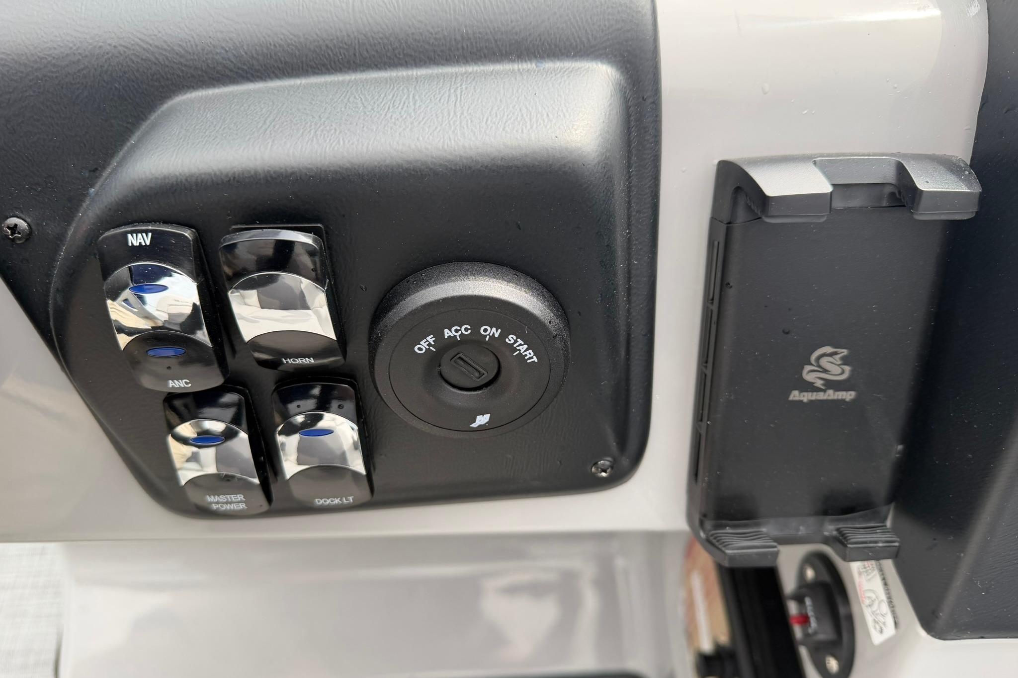 Control panel of a 2026 Lowe LS 190 boat with switches and ignition.