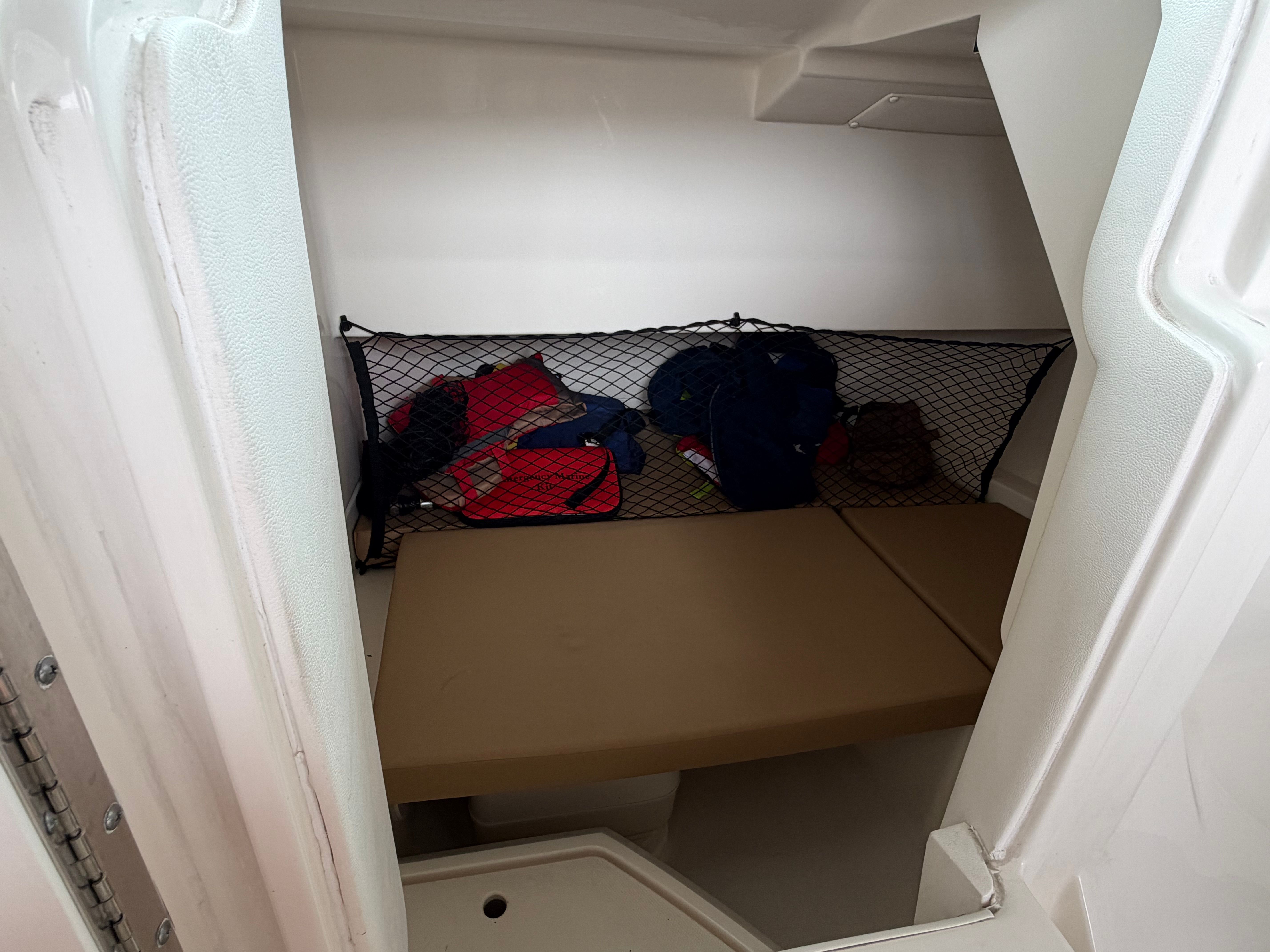Interior of 2020 Sea Ray SDX 250 Outboard with storage area.