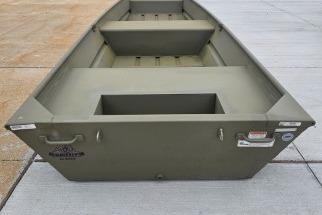 2026 Tracker Grizzly 14 Jon boat on concrete surface, showcasing its sturdy design.