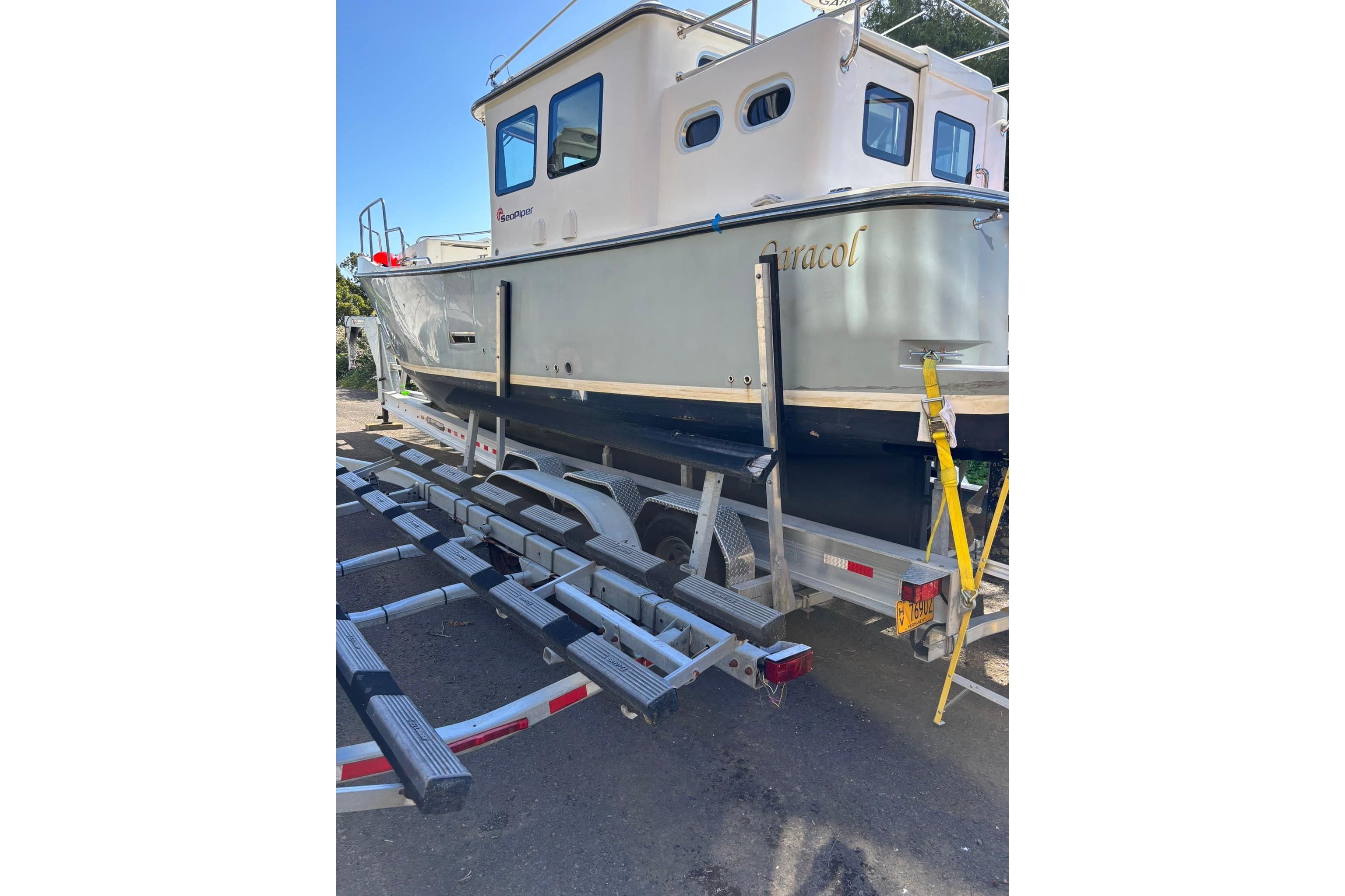2020 SeaPiper 35 boat on trailer, side view, outdoors.