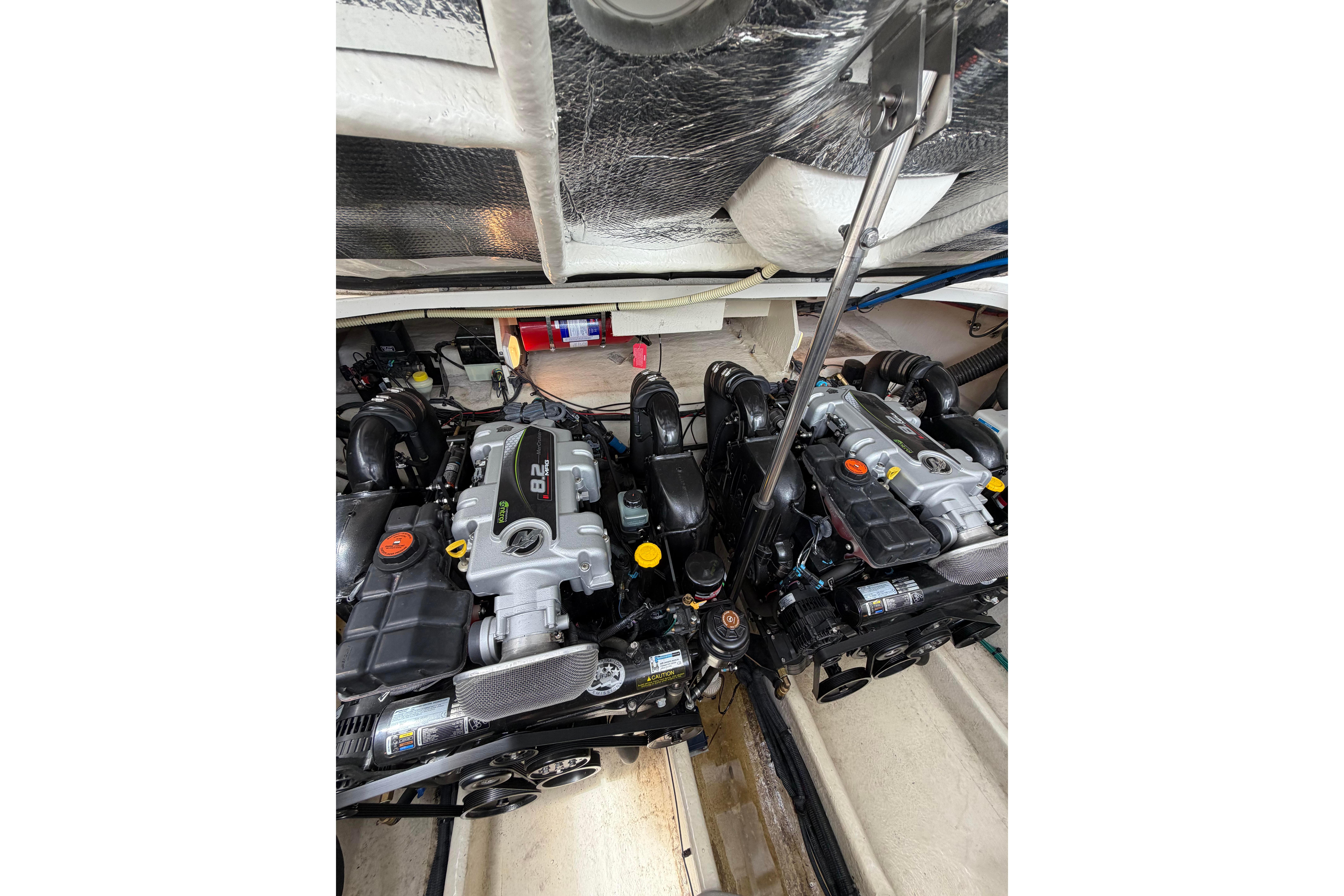 Engine compartment of 2012 Sea Ray Sundancer 370 with dual engines visible.